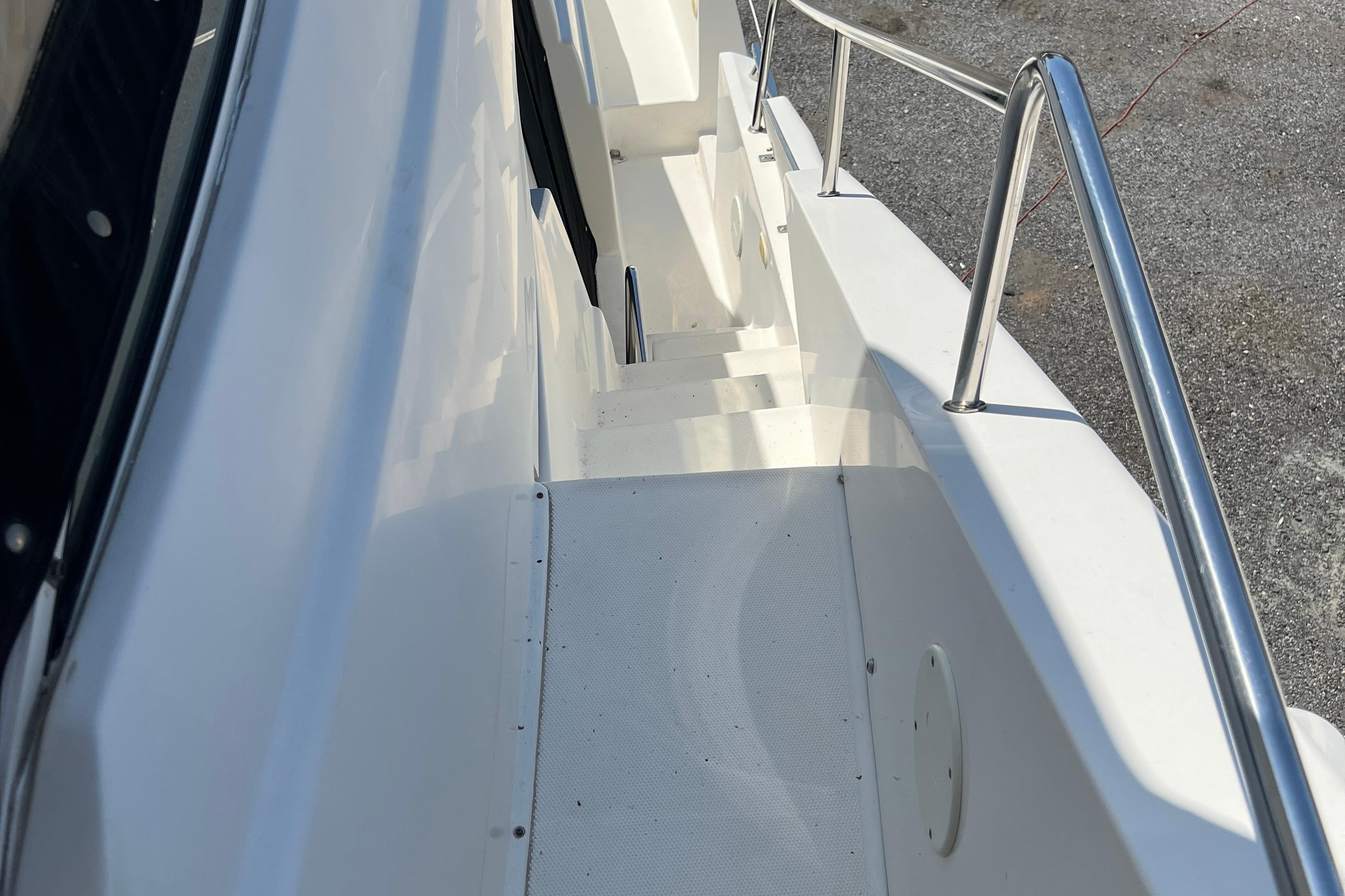 Stairway on 2002 Silverton 453 Motor Yacht with stainless steel railing.
