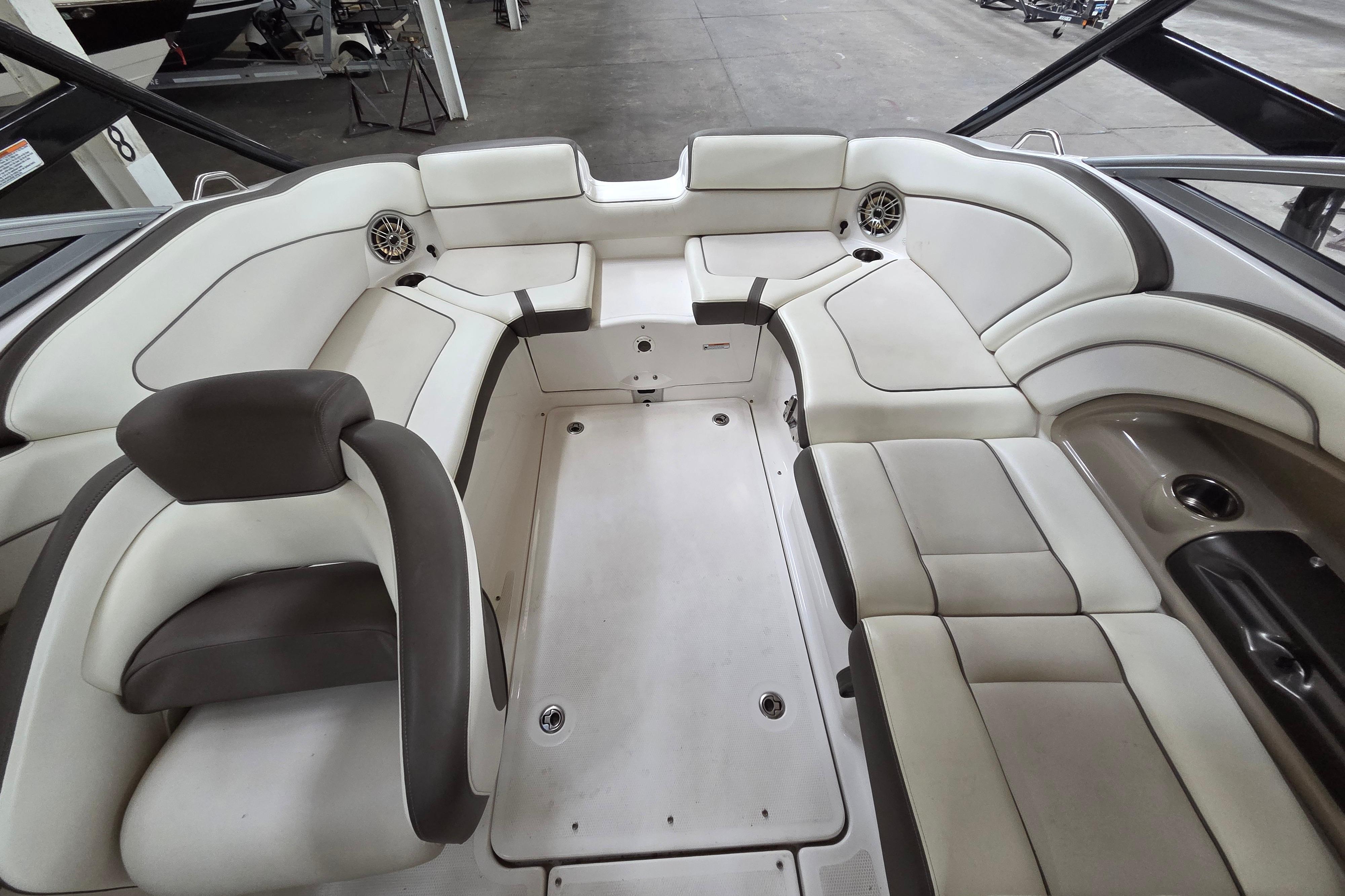 Interior of a 2013 Yamaha 242 Limited S boat with spacious seating.