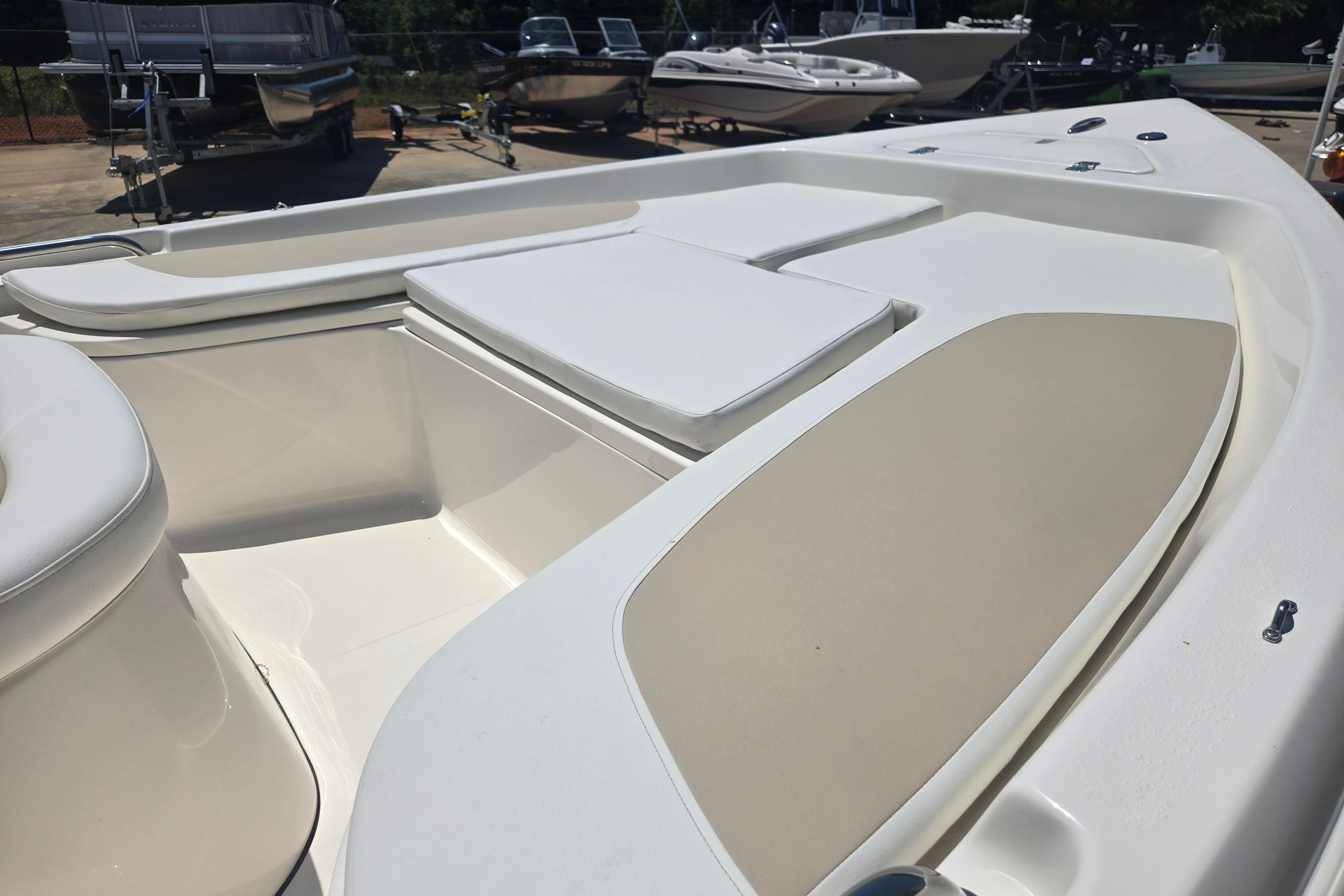 2026 Bulls Bay 2000 boat interior with cushioned seating and storage compartments.