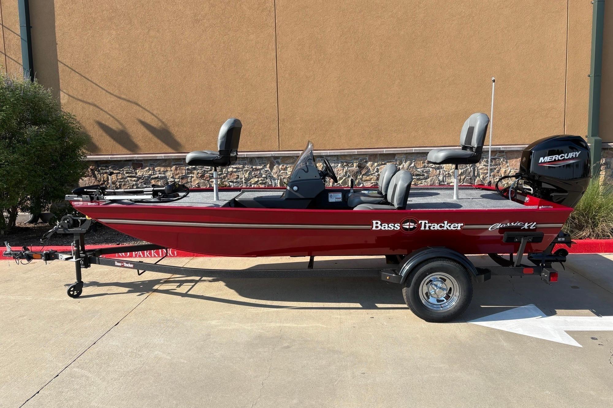 2026 Tracker Bass Tracker Classic XL boat with Mercury engine, parked outdoors.