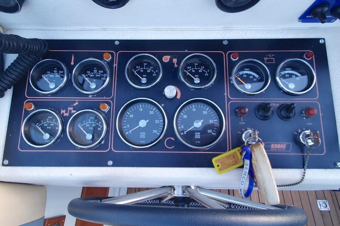 Control panel of a 1989 Fairey Spearfish MKIII boat with gauges and switches.