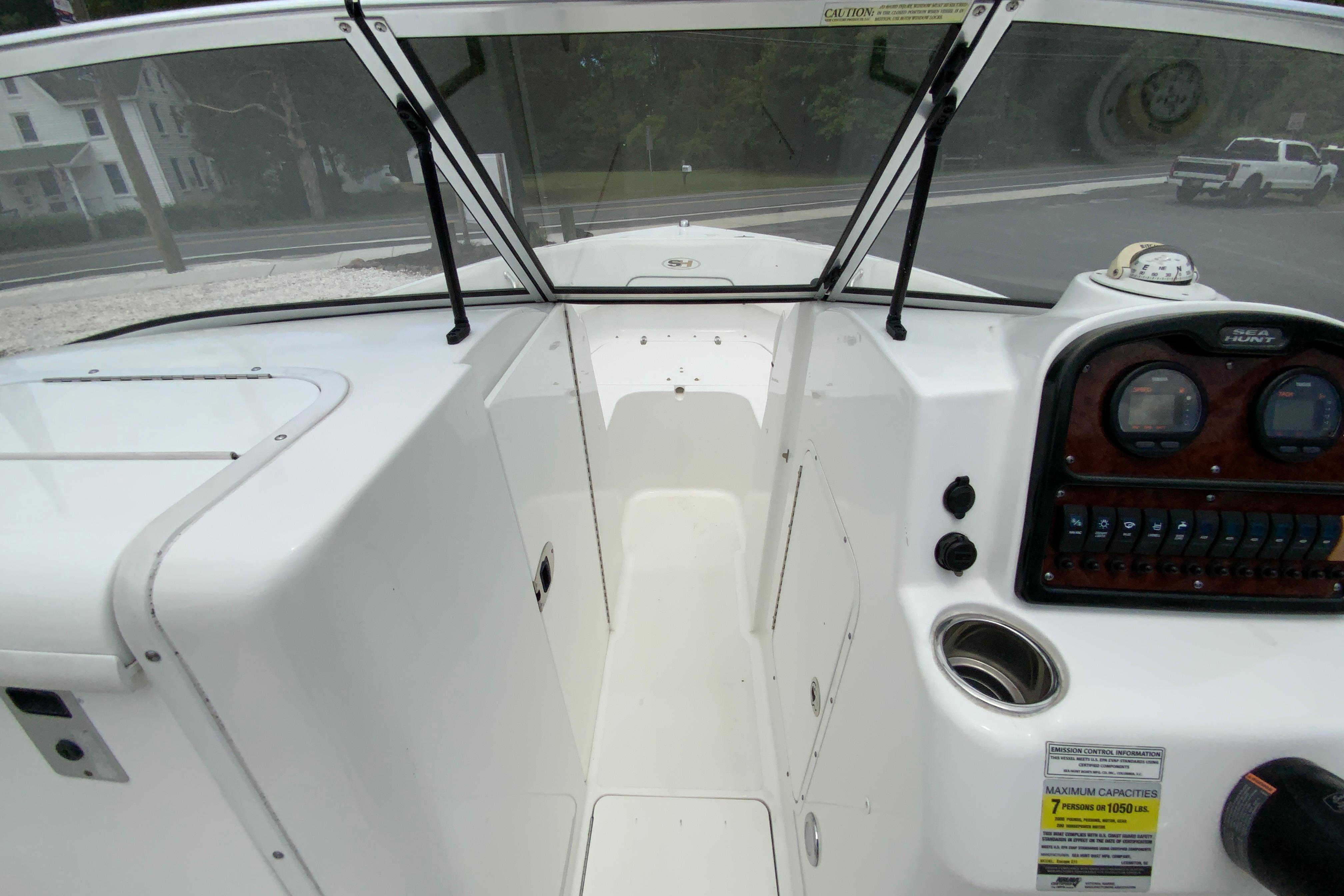 2014 Sea Hunt Escape 211 LE boat interior with dashboard and windshield view.