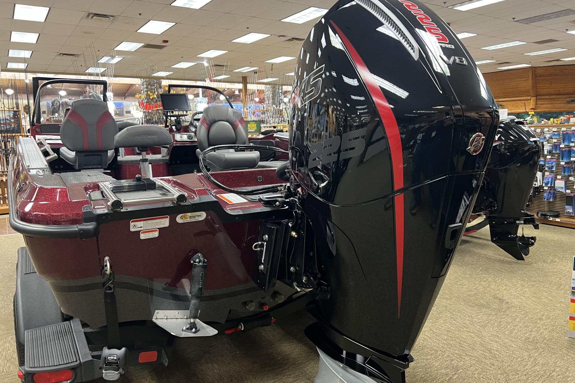 2026 Nitro ZV20 Pro boat with powerful engine displayed in a showroom.