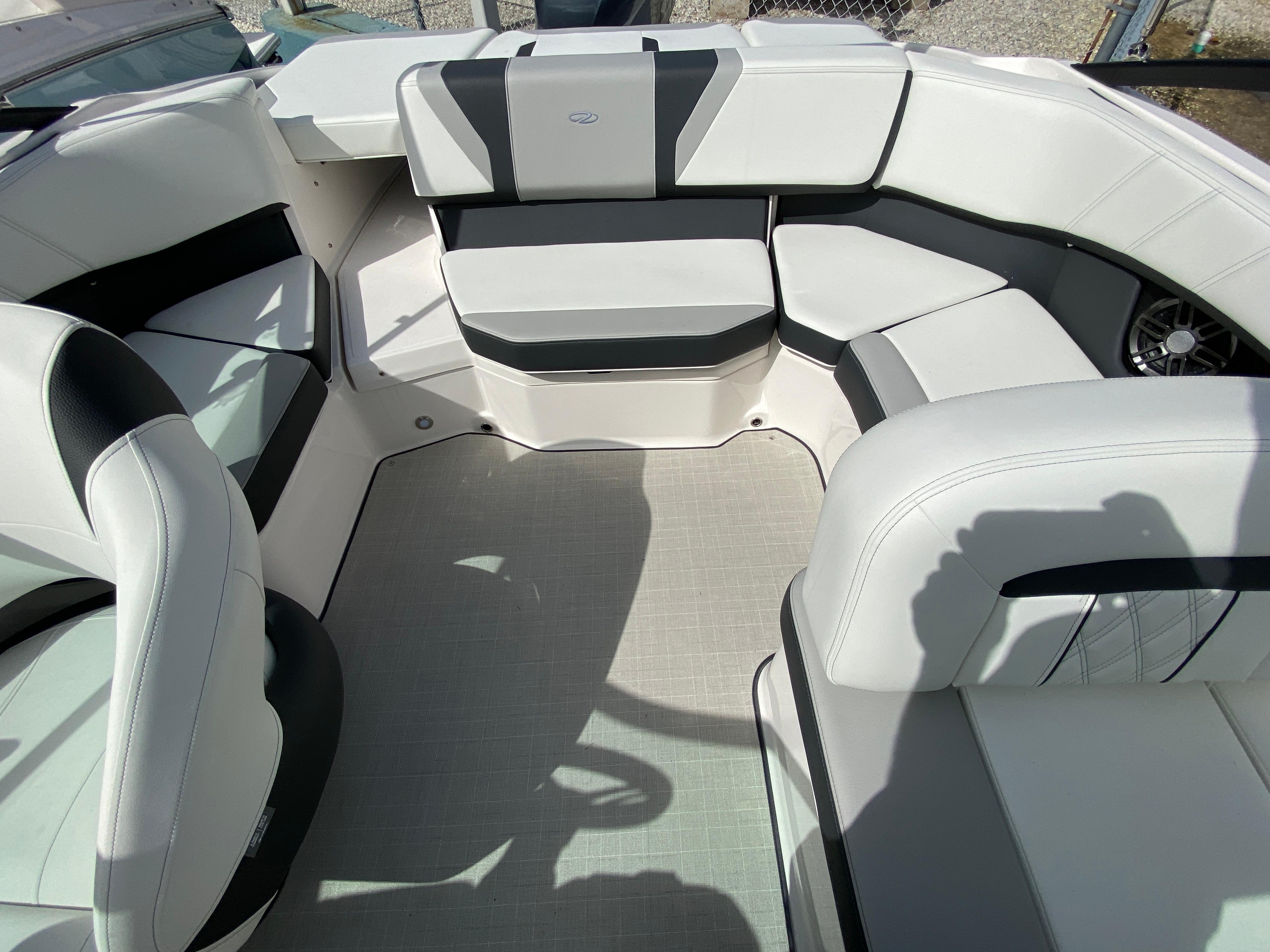 2026 Regal 21 OBX boat interior with white and black seating arrangement.