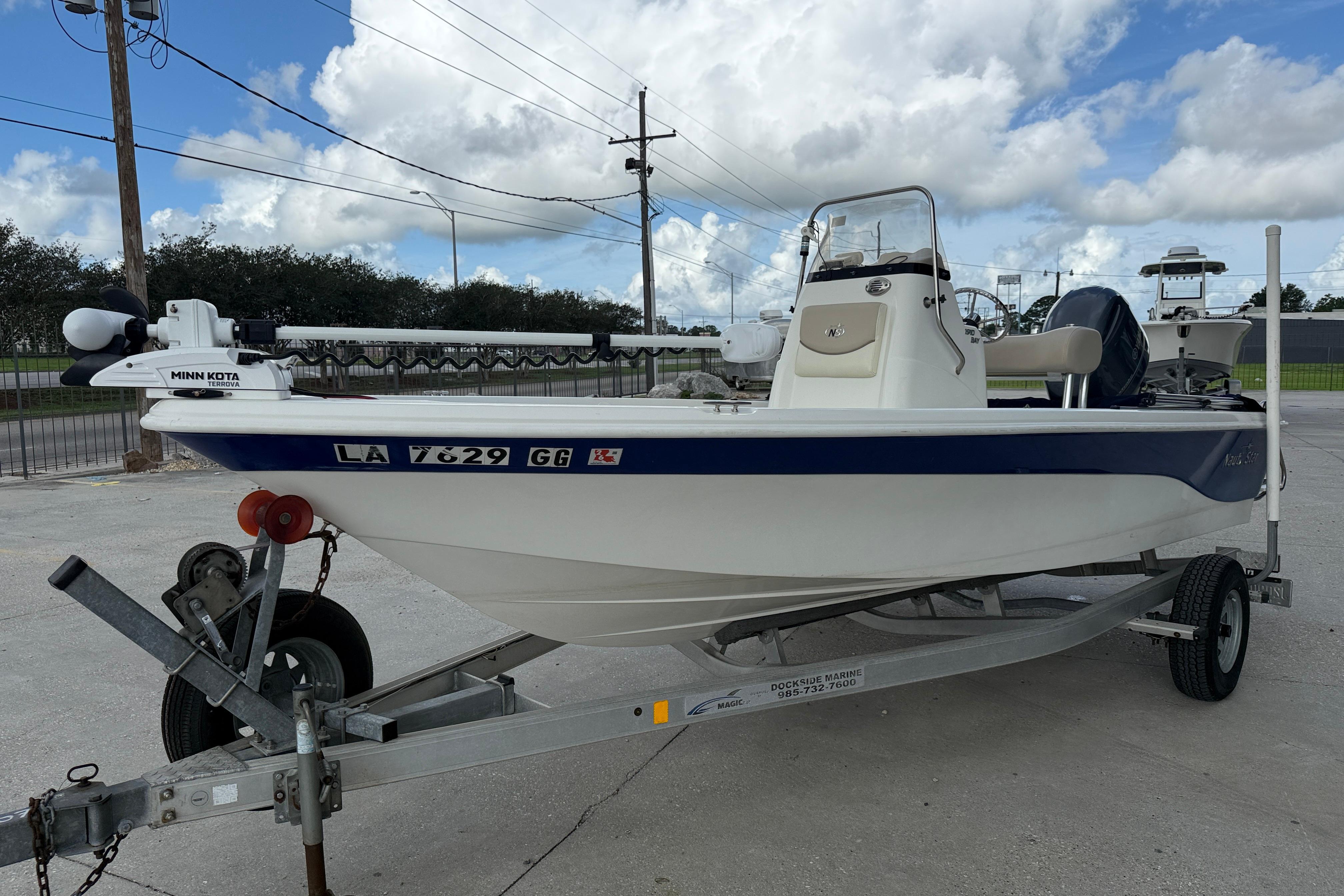 2017 NauticStar 1910 NauticBay boat on trailer, featuring Minn Kota trolling motor.