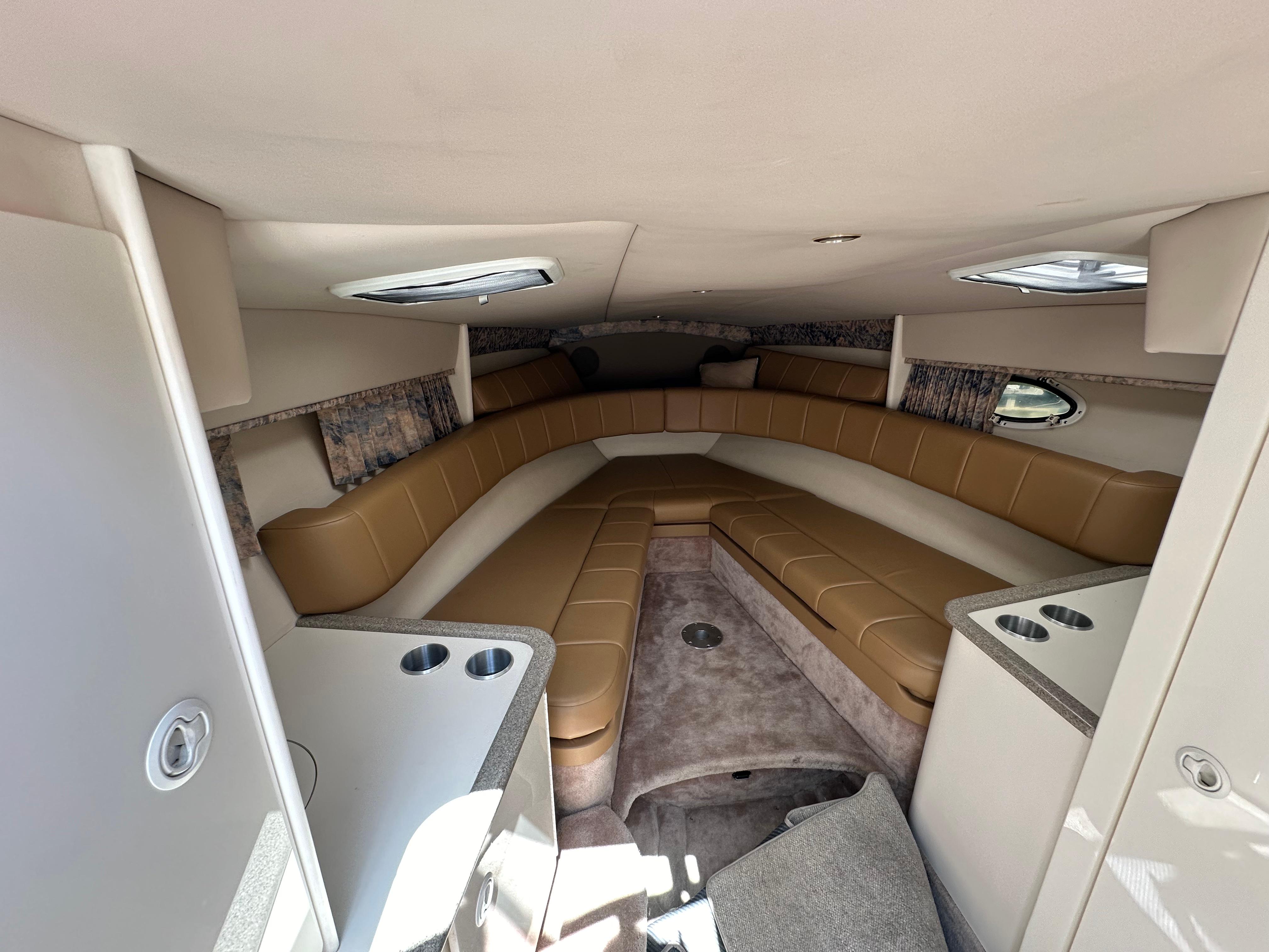 Interior of 2000 Formula 330 SS boat with tan seating and modern design.