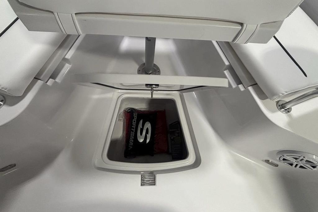 2026 Sportsman Open 252 Center Console storage compartment with branded bag inside.