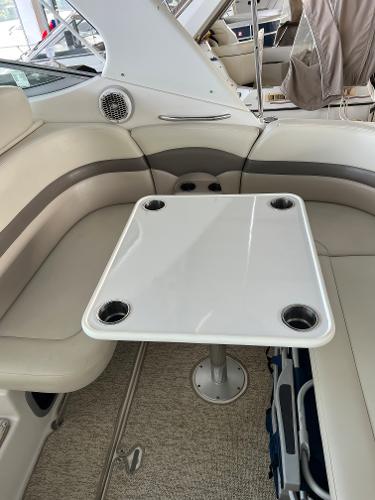 Interior of a 2008 Chaparral Signature 310 with table and seating area.