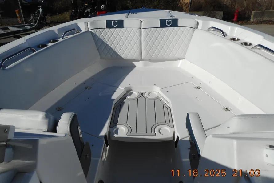 Interior view of 2026 Sea Fox 268 Traveler boat with white seating and table.