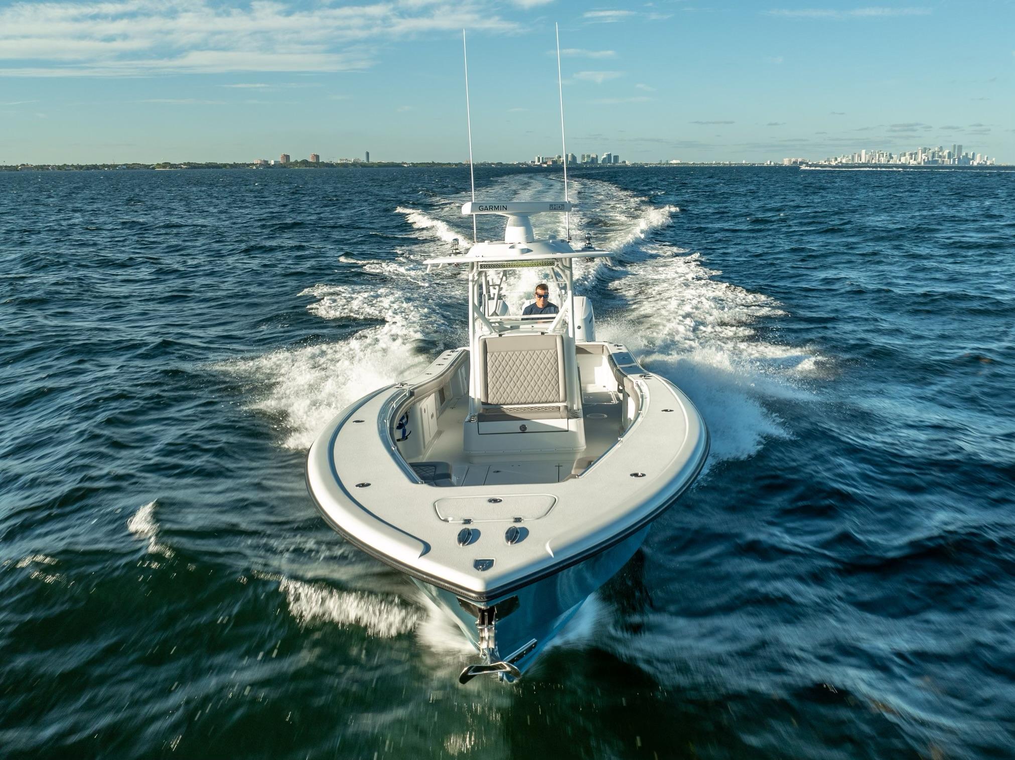 2023 Yellowfin 36 boat cruising on open water under clear skies.
