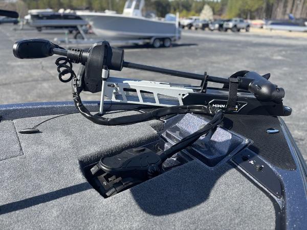 Trolling motor on Phoenix 920 Elite boat, 2025 model, in a parking lot setting.