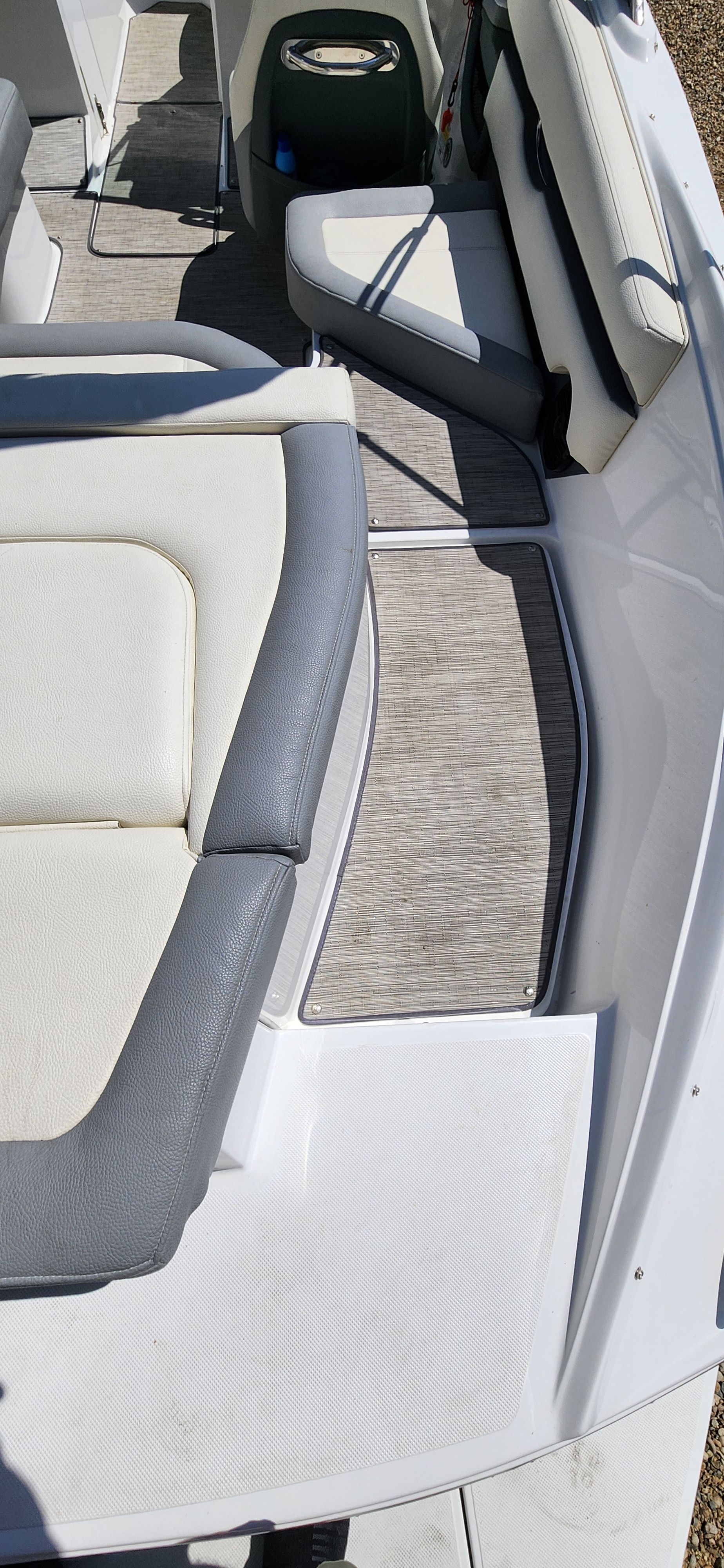 Interior view of a Cobalt CS22 boat with gray and white seating.