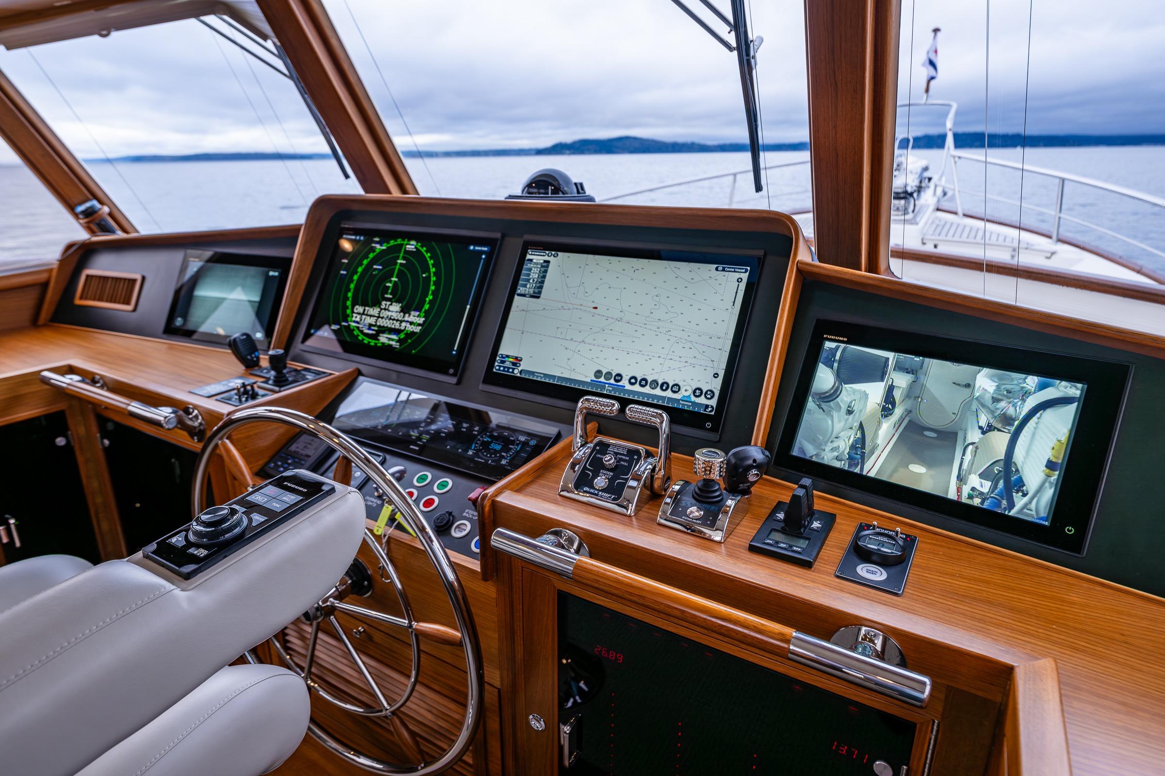 Pilothouse of 2026 Fleming 55 yacht with advanced navigation and control systems.