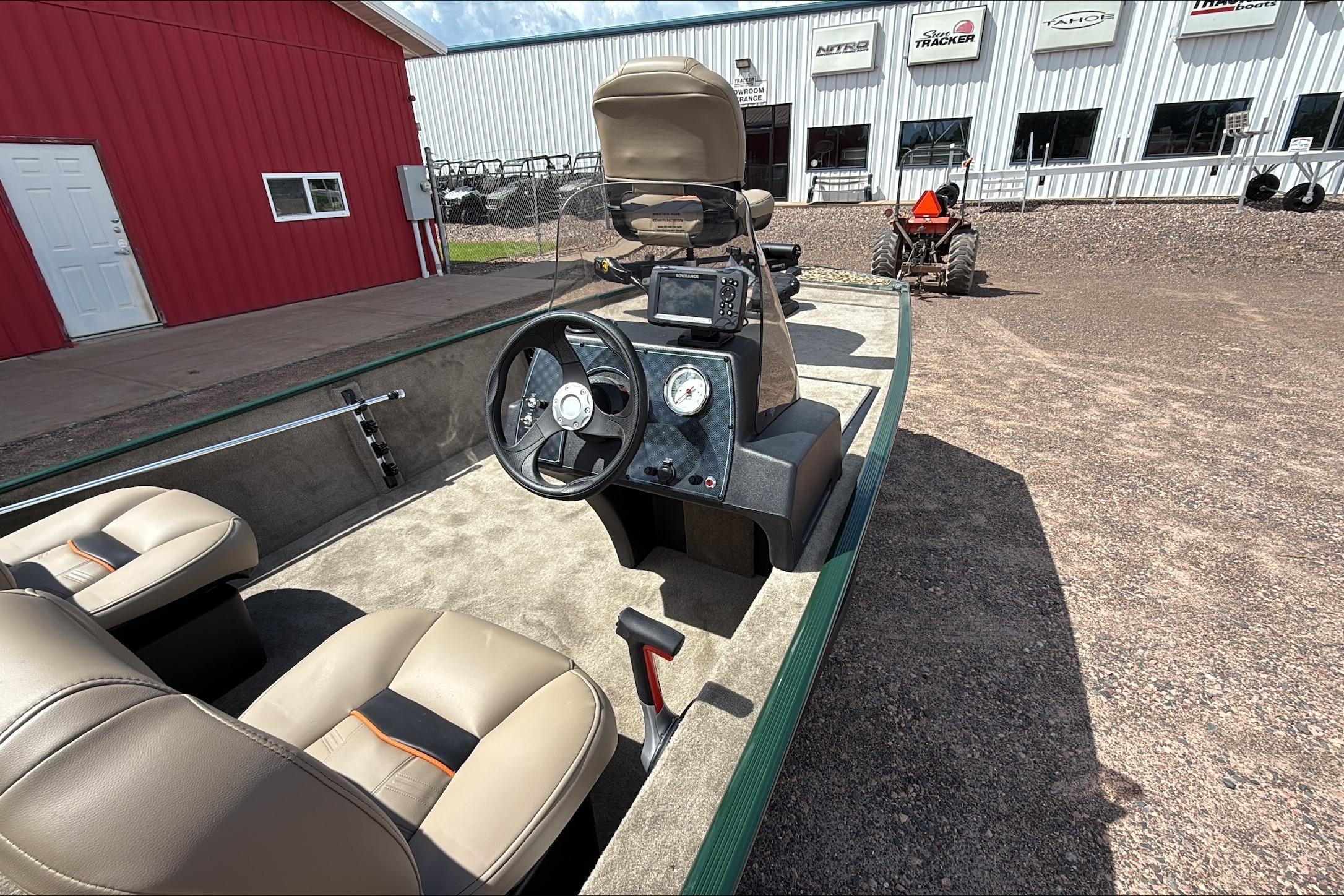 2026 Tracker Bass Tracker Classic Limited boat interior with steering wheel and seats.