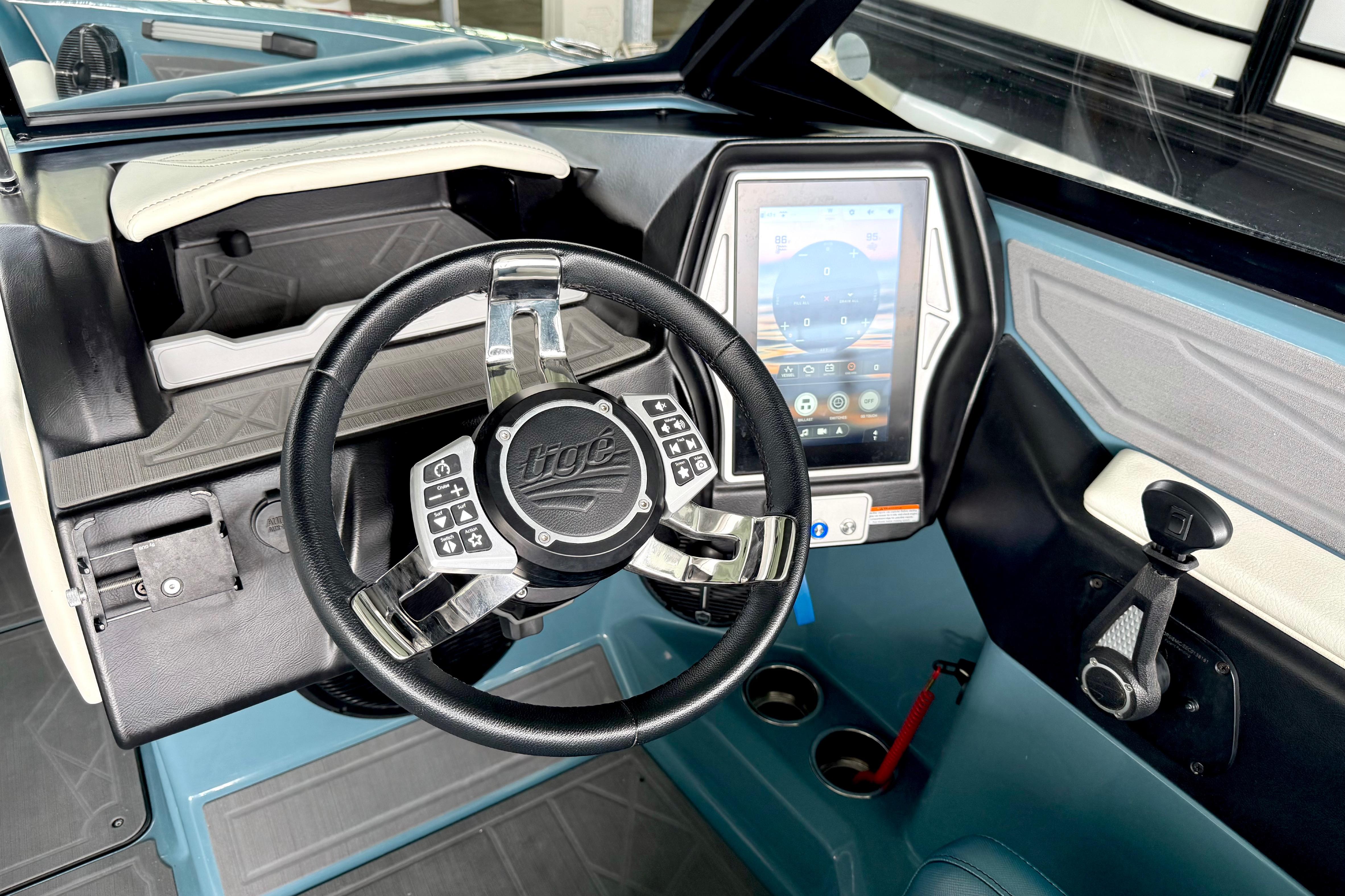 2021 Tige Z3 boat dashboard with touchscreen and steering wheel.