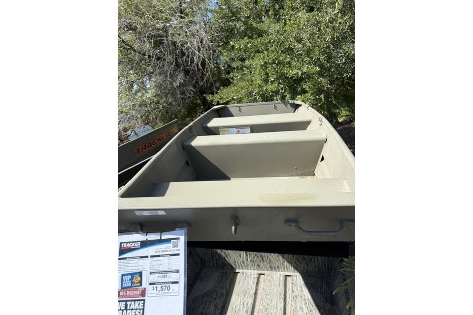 2026 Tracker Grizzly 10 Jon boat displayed outdoors with price tag visible.
