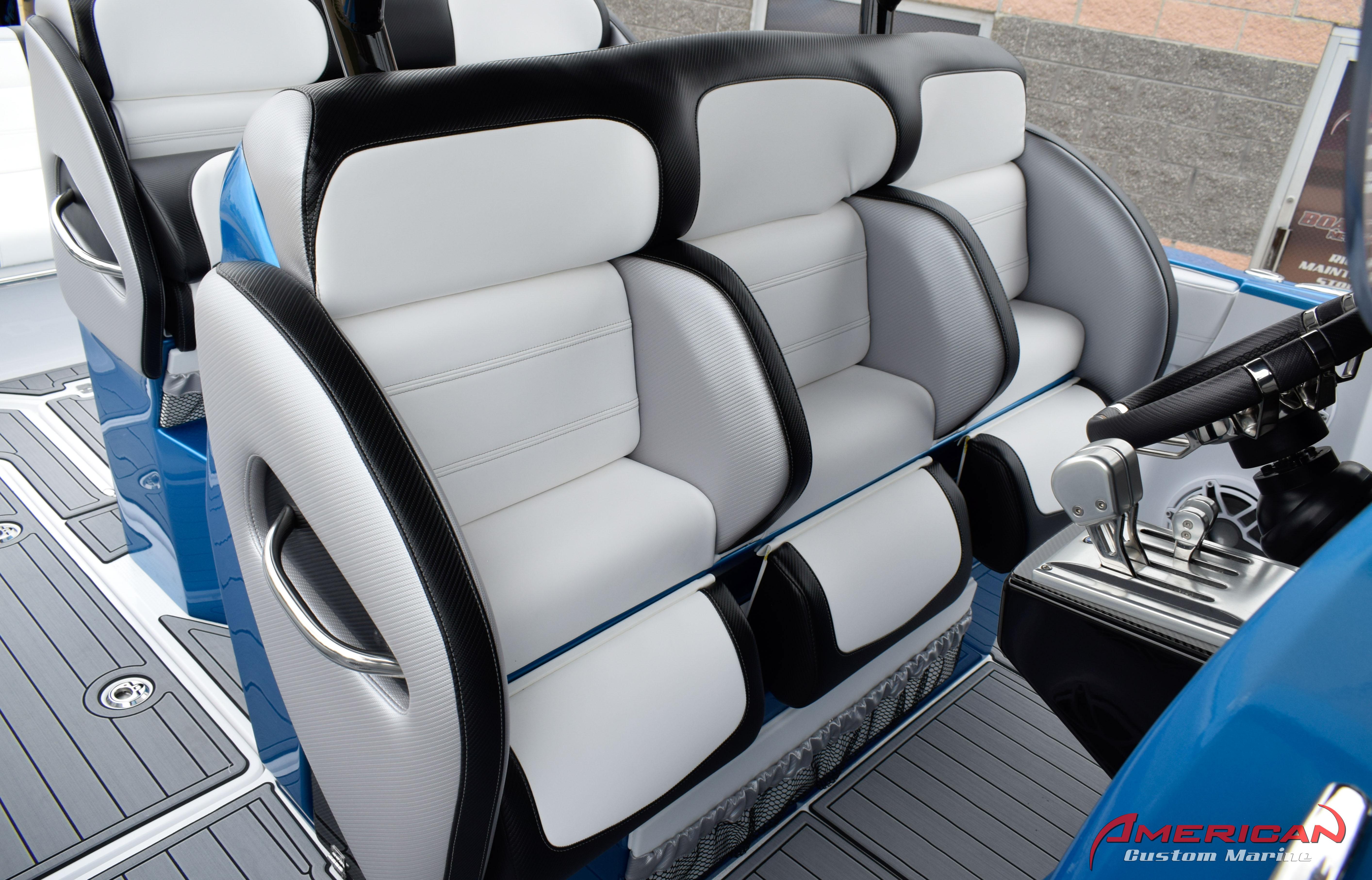 2025 Nor-Tech 390 Sport boat interior with luxurious seating and modern controls.