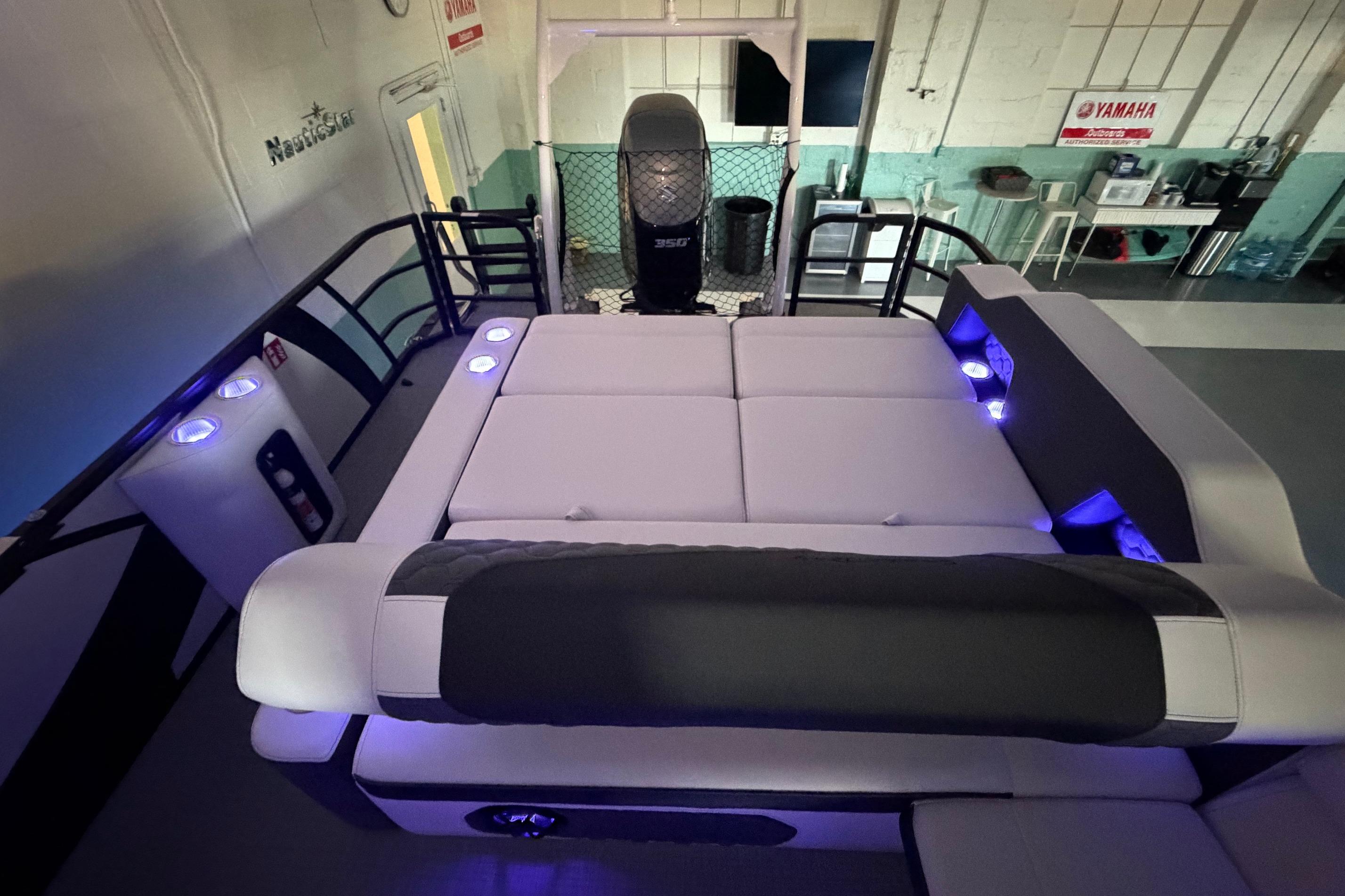 Luxurious interior of 2026 South Bay 525SB2 pontoon boat with ambient lighting.