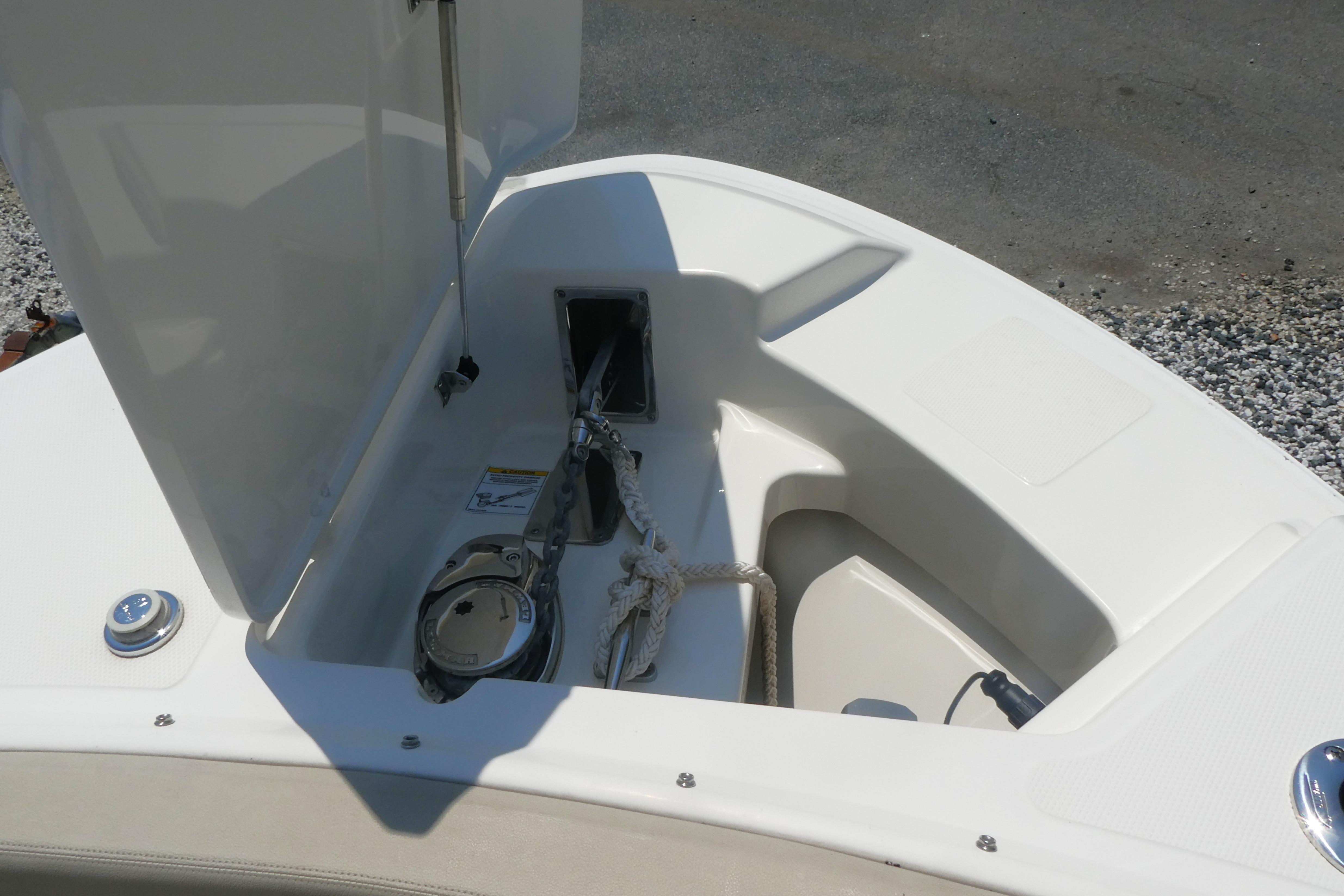 2022 Boston Whaler 240 Vantage anchor storage compartment with open hatch.