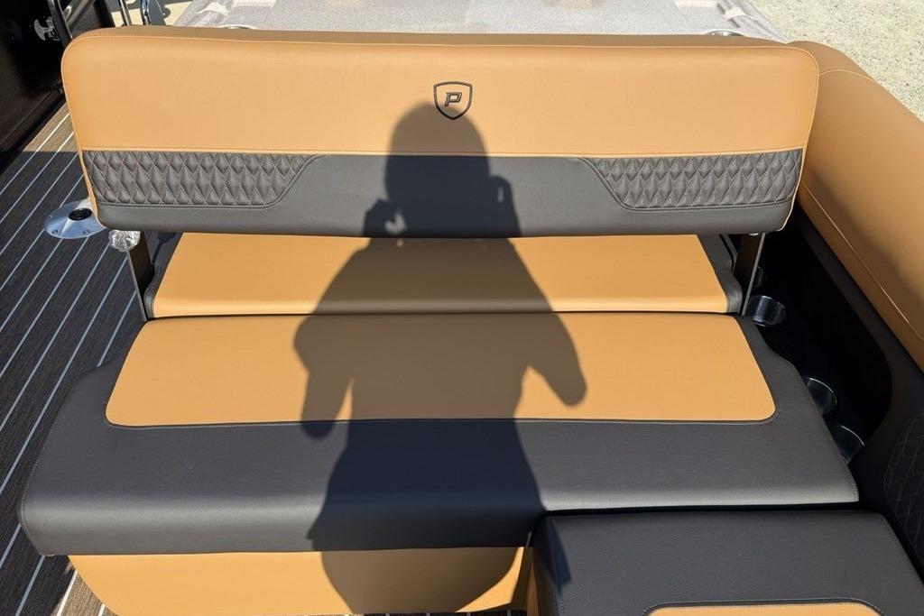 Premier 250 Solaris RS CL 2026 boat seat with tan and black upholstery, shadow visible.