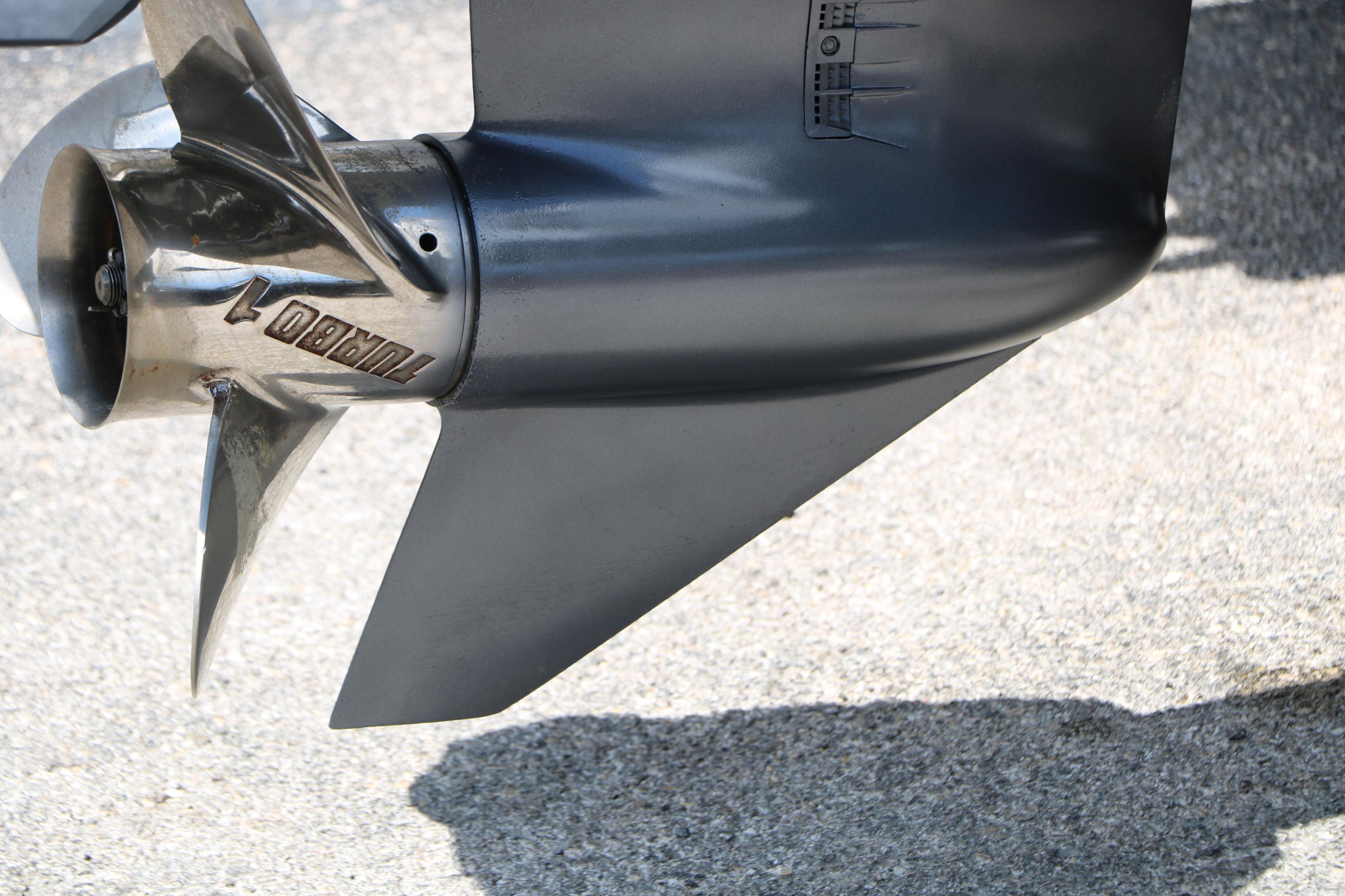 Close-up of a 2015 Sea Hunt BX 22 BR boat propeller on a concrete surface.