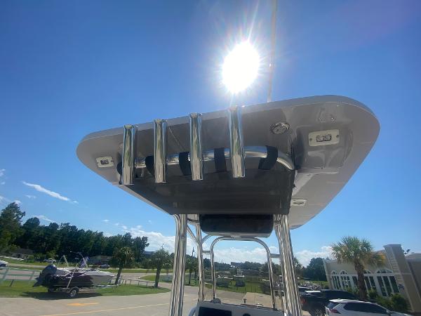 2024 Key West 239 FS boat with T-top under sunny sky.