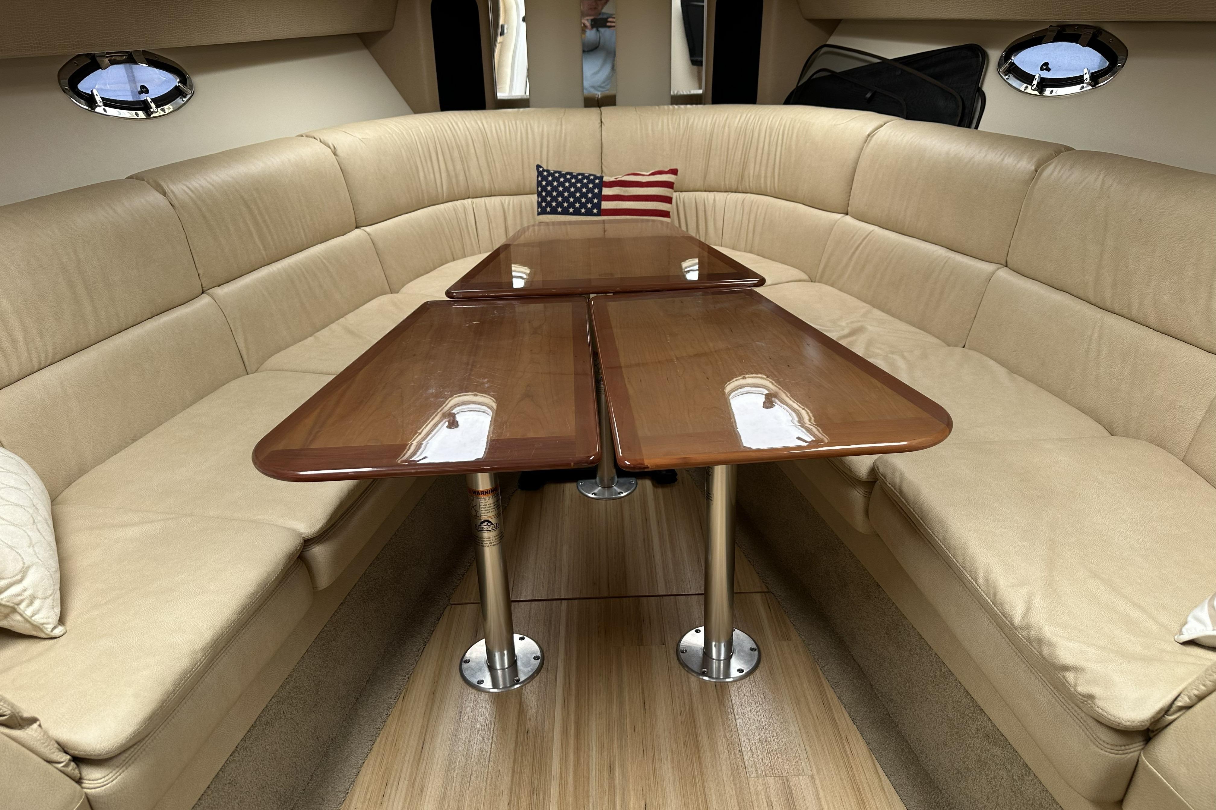 Luxurious interior of 2011 Formula Yachts 40ss with elegant seating and wooden table.