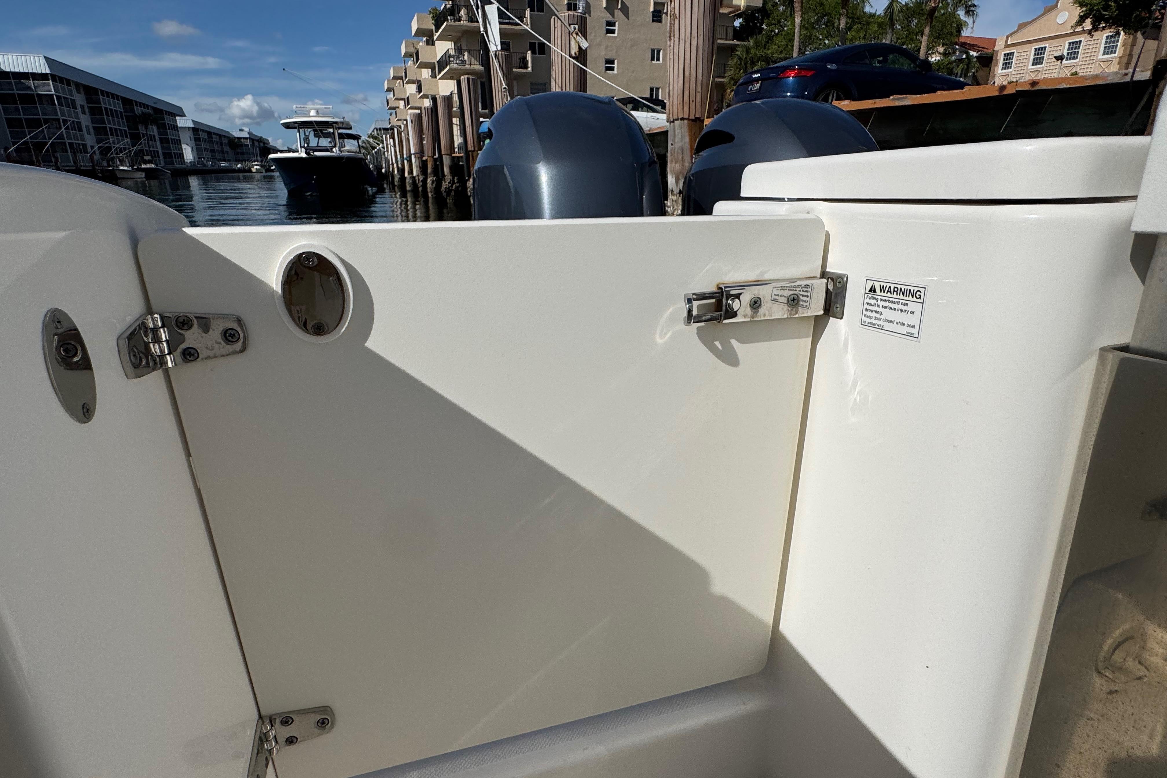 2022 Pursuit DC 266 Dual Console boat interior with docked marina view.