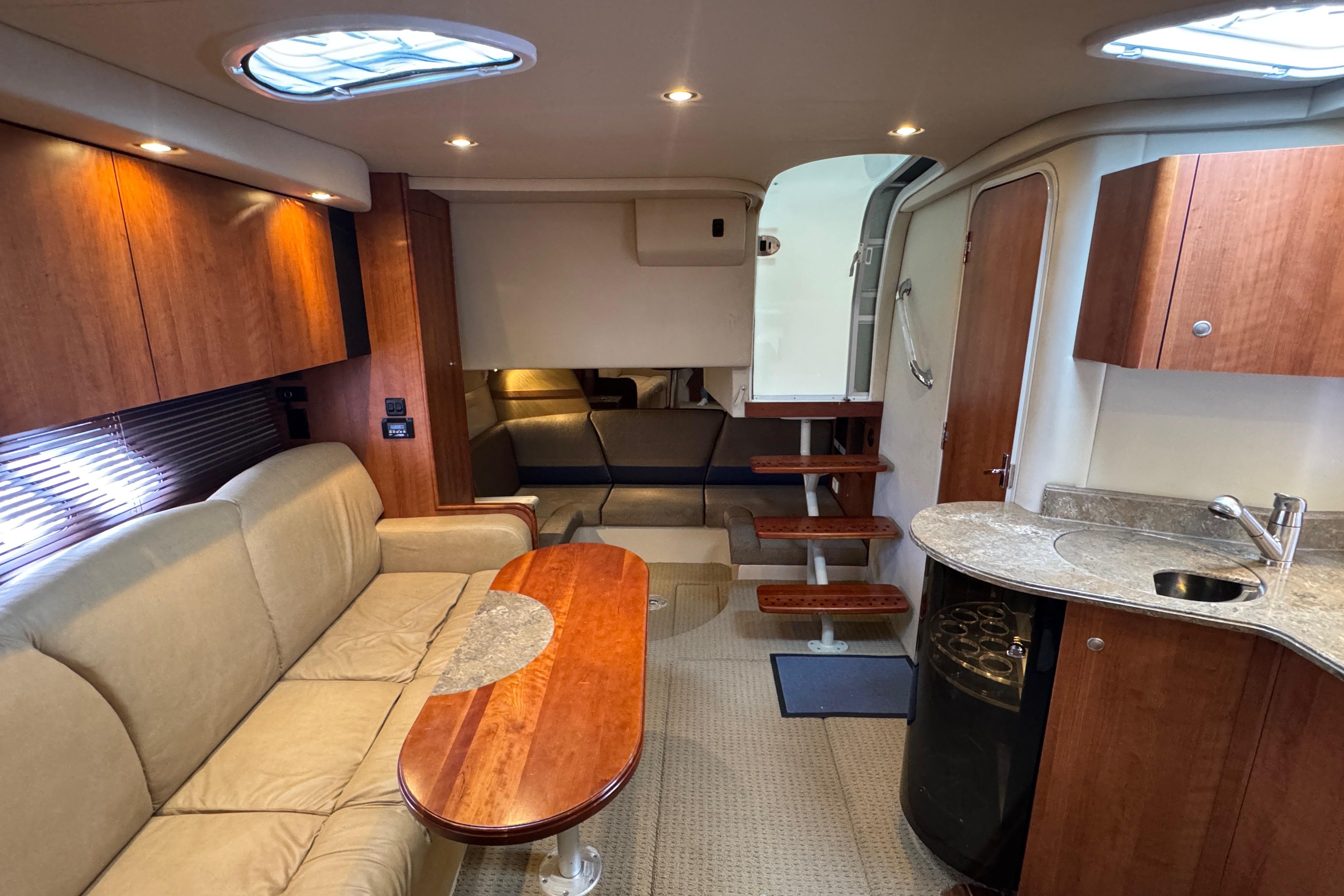 Luxurious interior of 2008 Cruisers Yachts 360 Express with elegant seating and kitchenette.