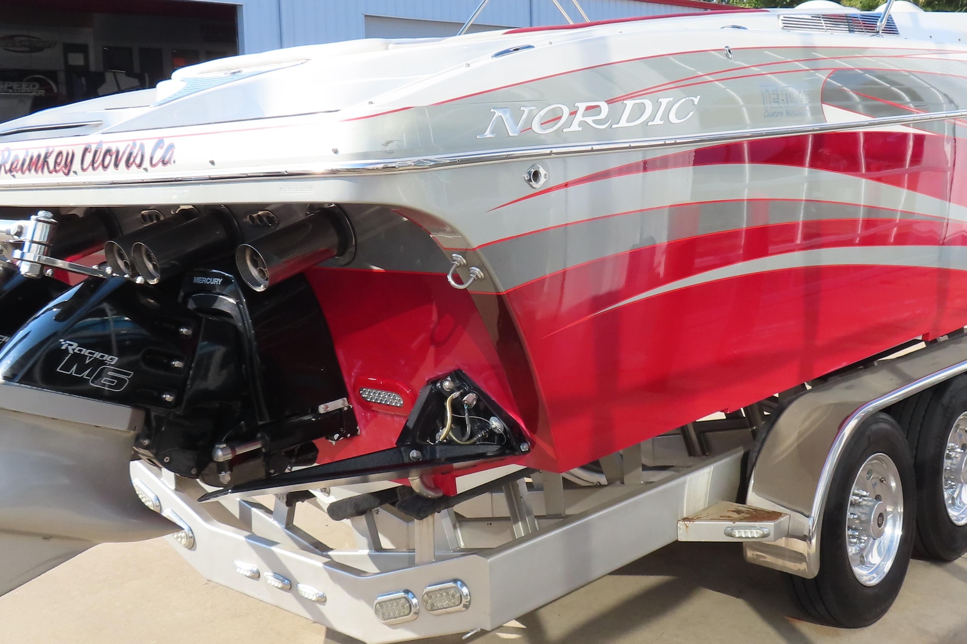 2013 Nordic 39 Poker Run boat with red and silver design, featuring Mercury Racing M6 engine.