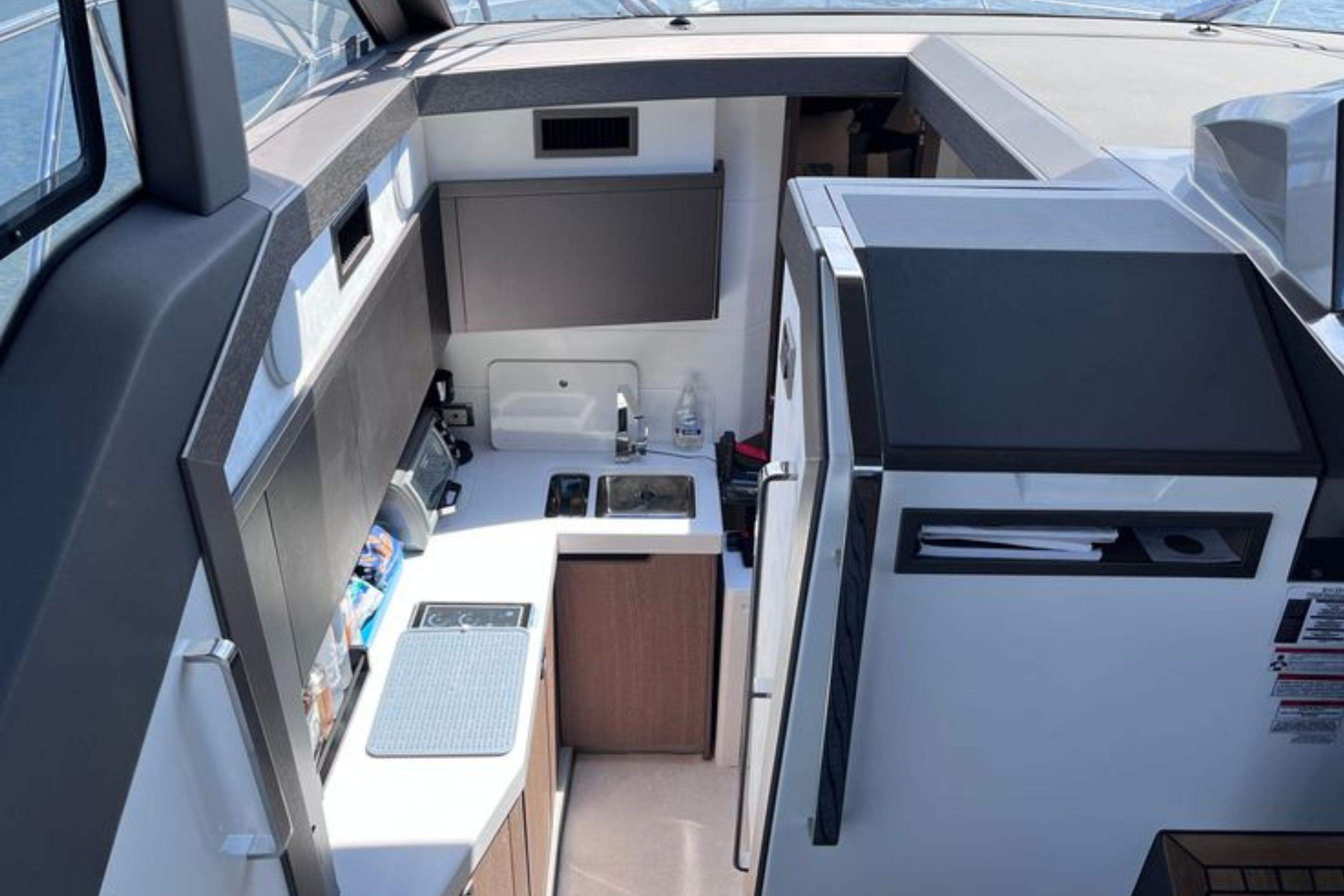 2024 Galeon 425 HTS yacht interior kitchen with modern appliances and sleek design.