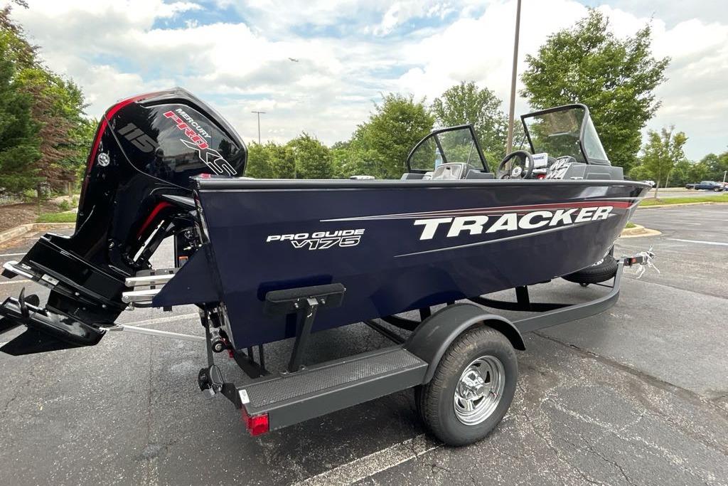 2025 Tracker Pro Guide V-175 WT boat on trailer in parking lot.