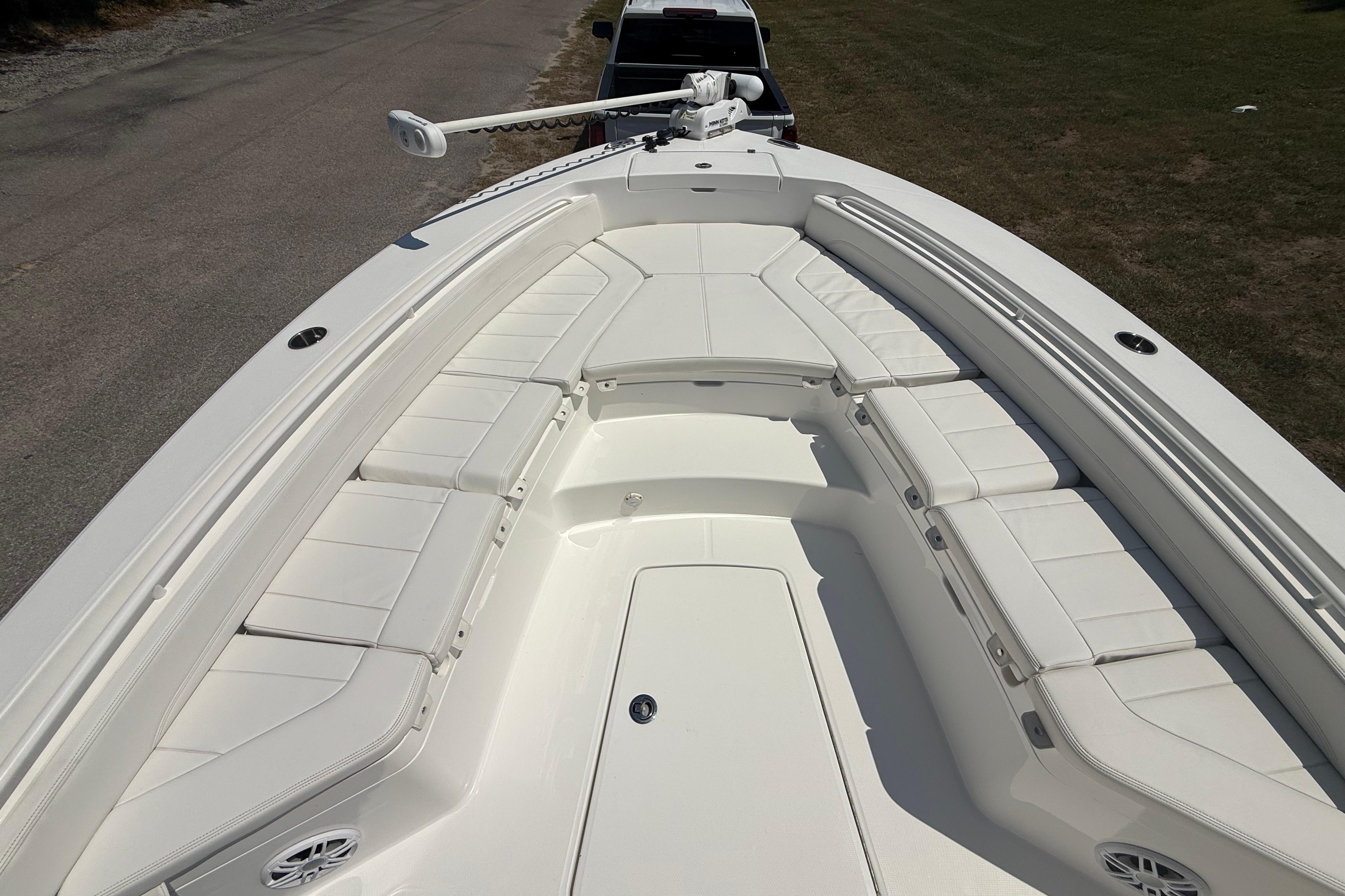 2023 Regulator 26XO boat with spacious white seating and sleek design.