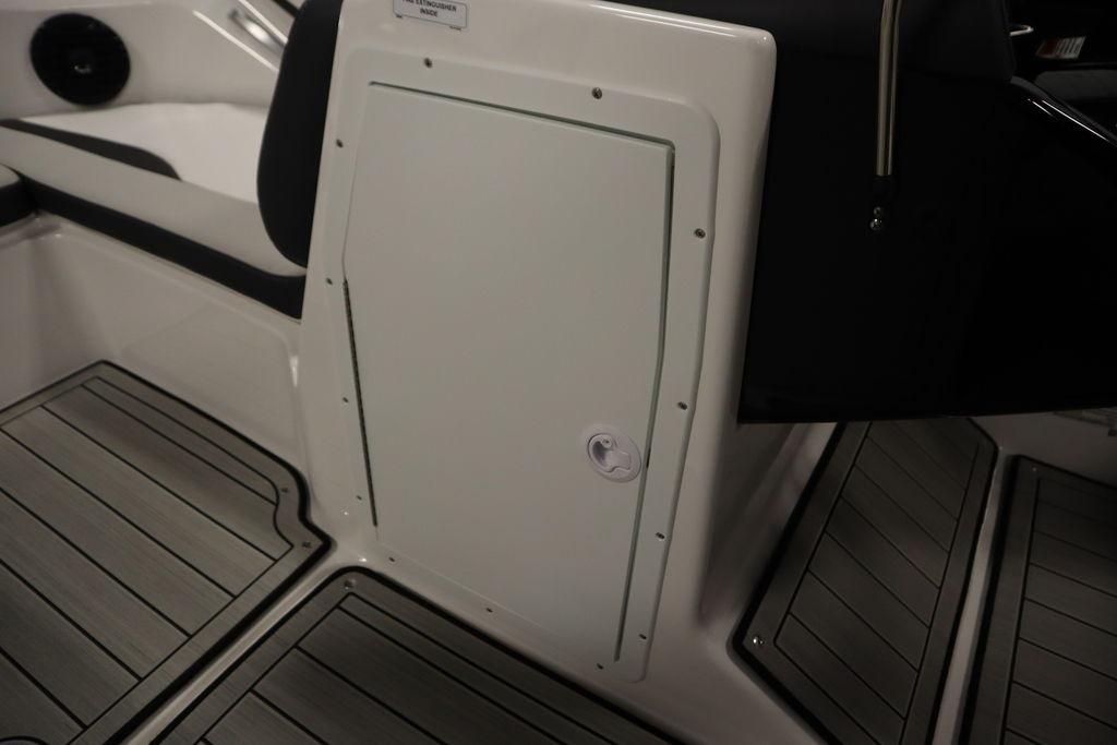 2026 Yamaha Boats 195S interior with sleek storage compartment and modern flooring design.