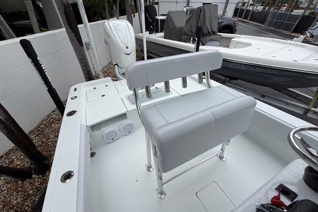 2025 Contender 26 Bay boat interior with seating and motor, showcasing modern design.