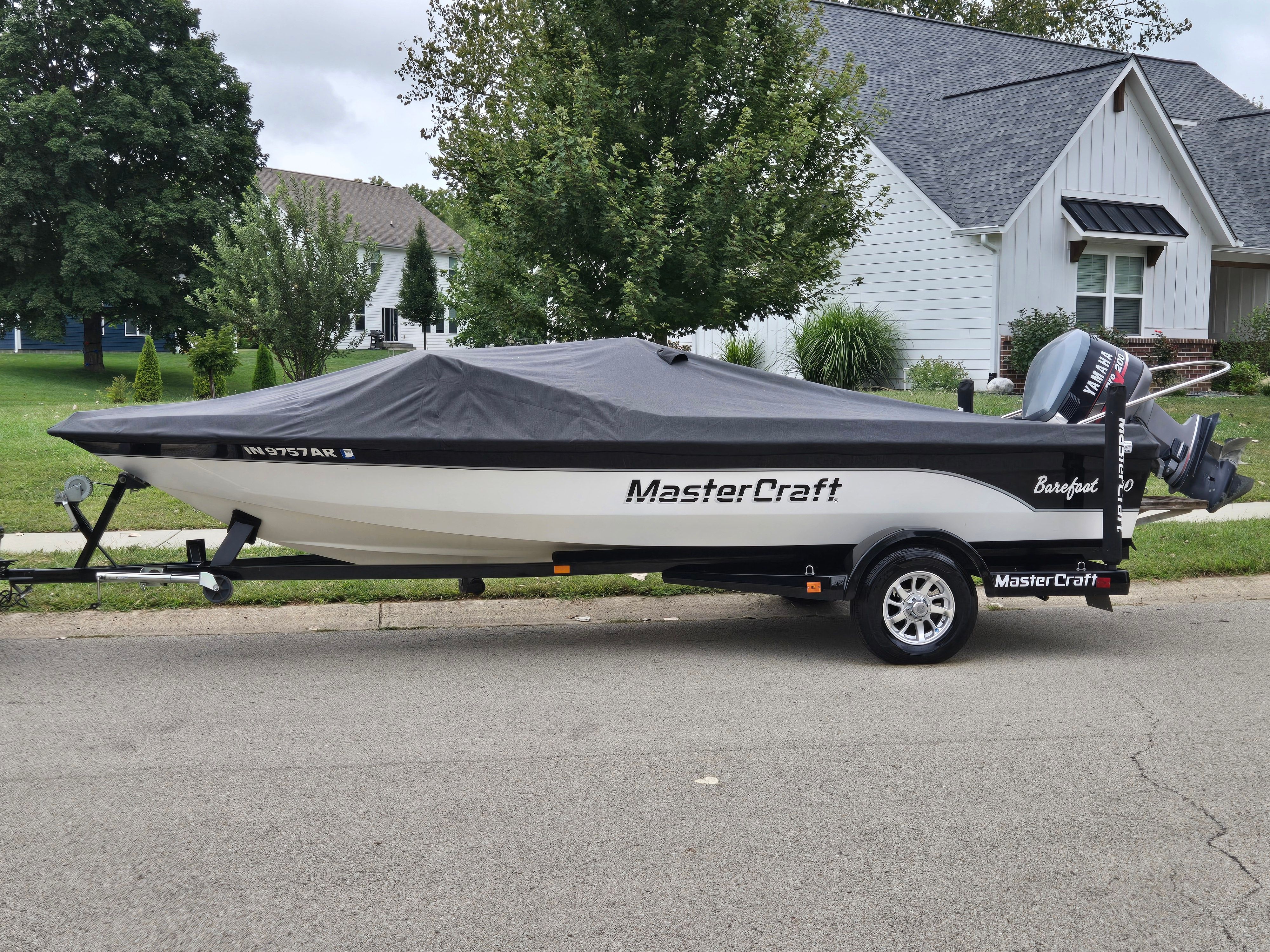 1991 MasterCraft Barefoot 200 boat with cover on trailer.