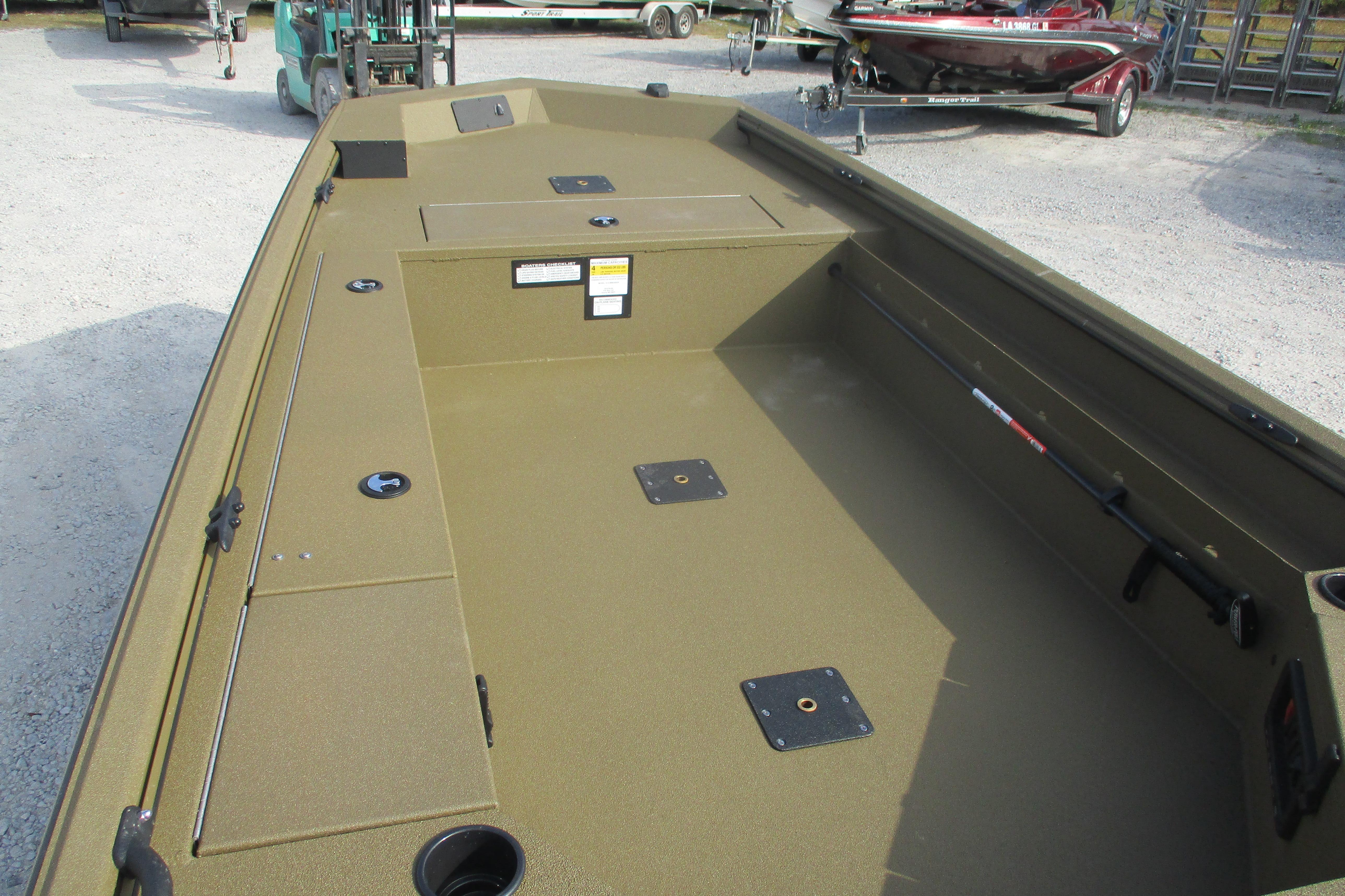 2026 Avid 16 Commander boat interior with spacious deck and storage compartments.