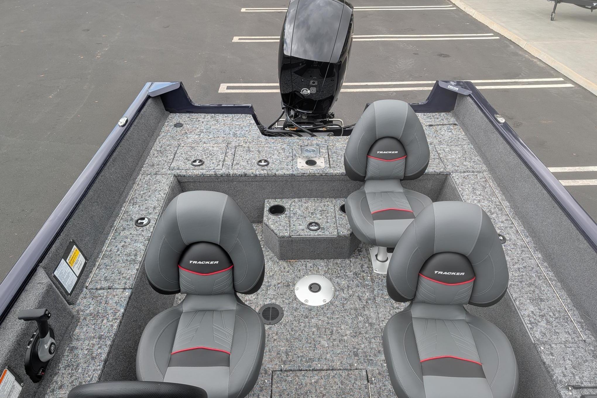 2026 Tracker Pro Guide V-175 WT boat interior with four gray seats and motor.