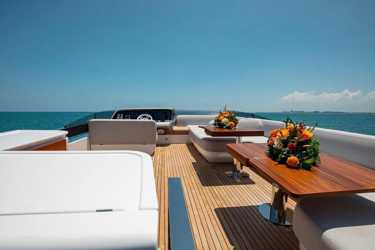 Luxurious 2022 Azimut S10 yacht deck with elegant seating and floral arrangements.