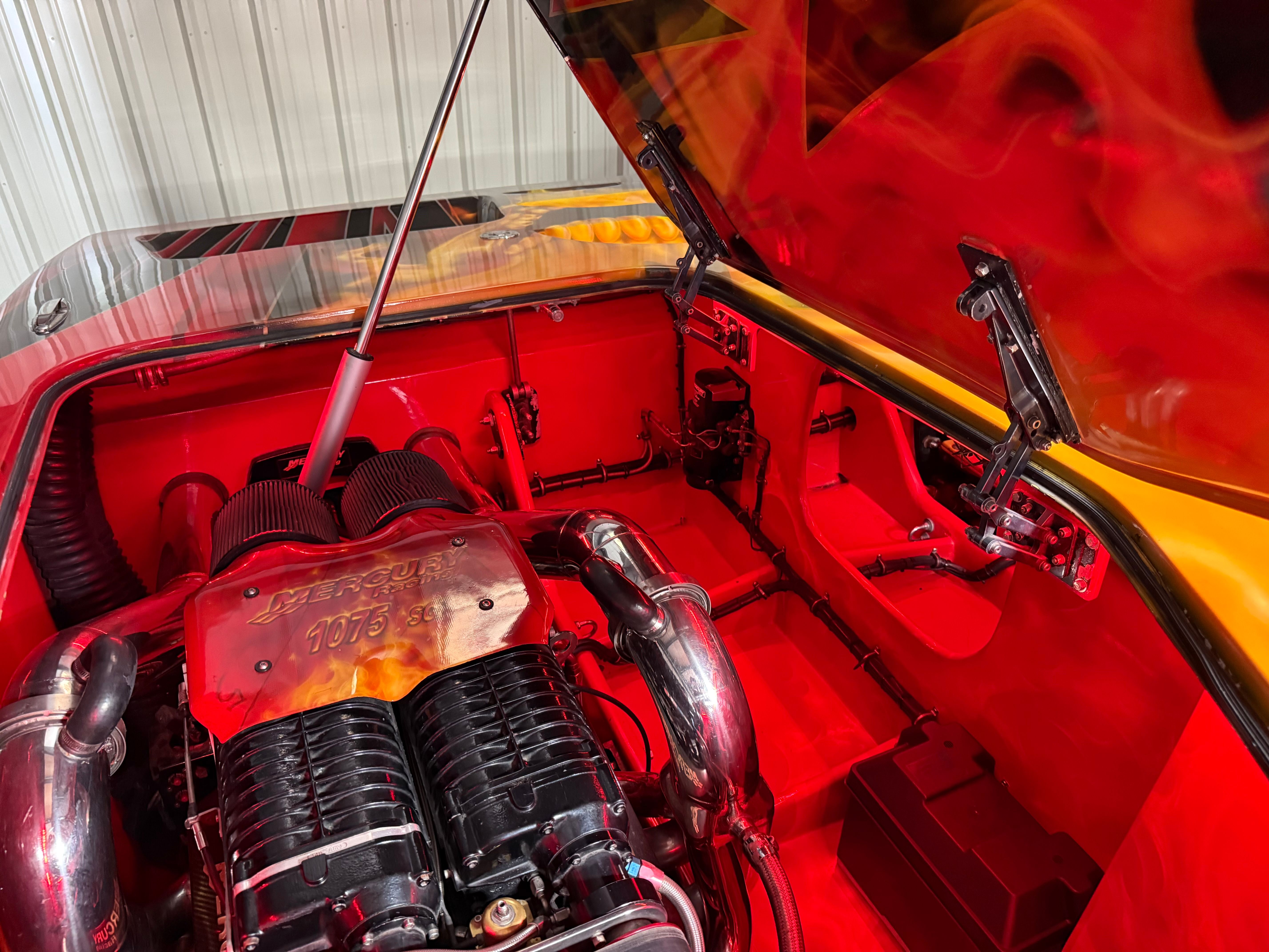 The engine compartment of a 2010 MTI CAT features a powerful engine with shiny metal components.