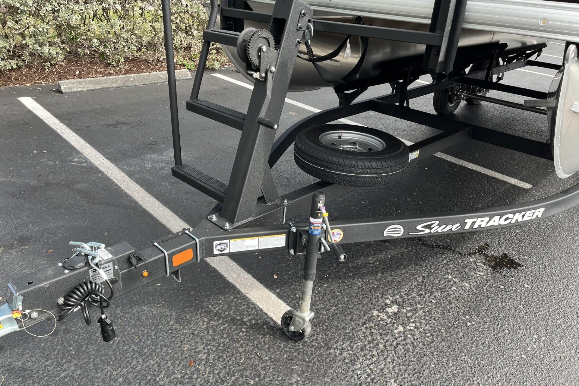 Trailer hitch of 2026 Sun Tracker Party Barge 20 DLX in parking lot.