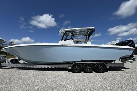 2023 Fountain 38 Tournament Edition boat on trailer under blue sky.