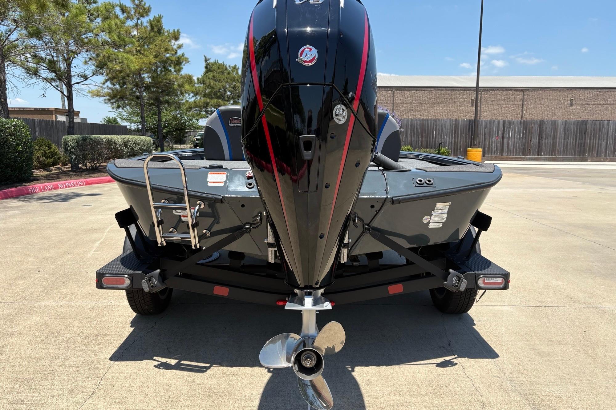 2025 Ranger ALPHA 208 boat on trailer, rear view with outboard motor.