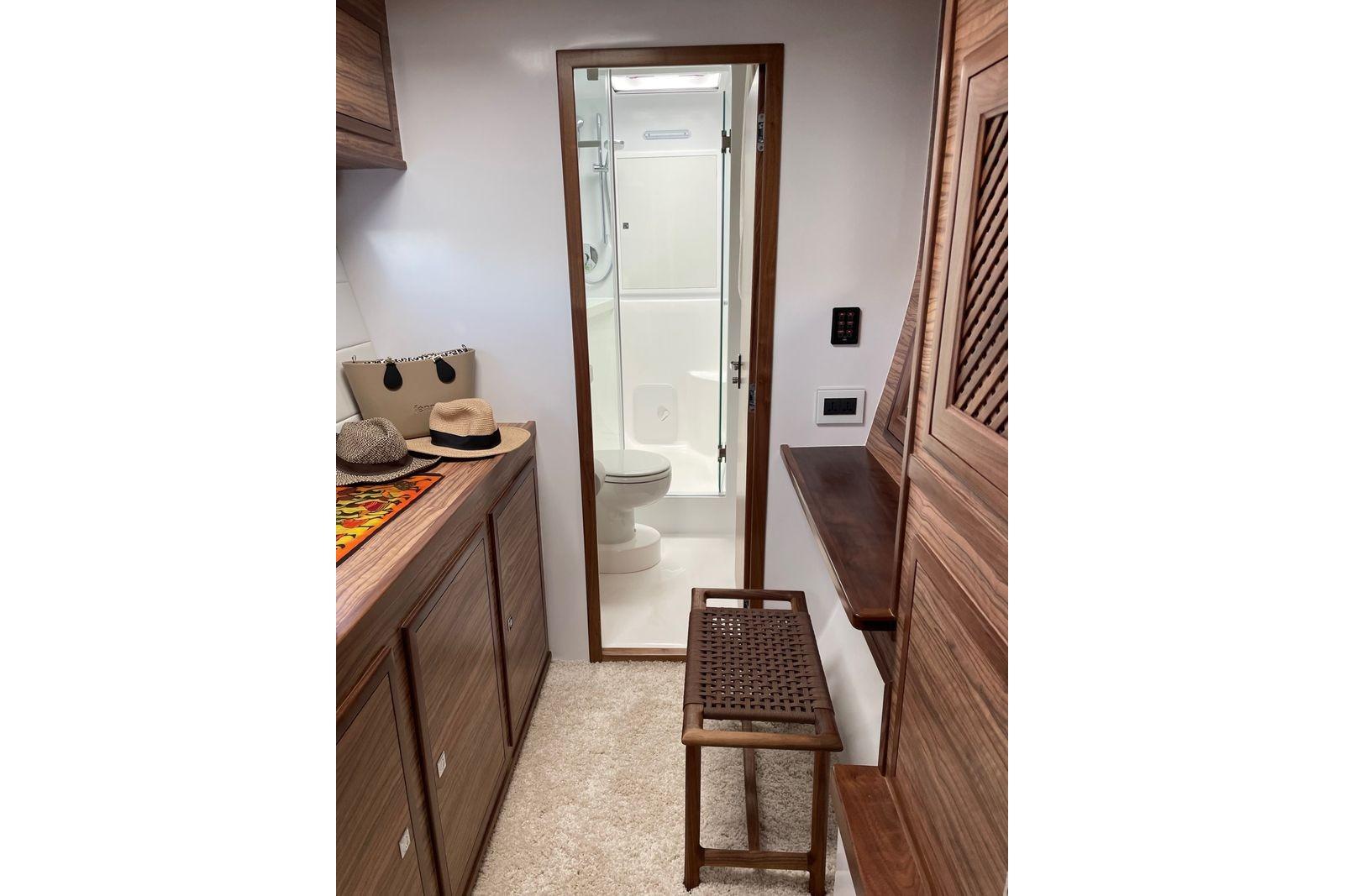 Luxurious 2017 St Francis 500SE interior with wooden cabinetry and modern bathroom.