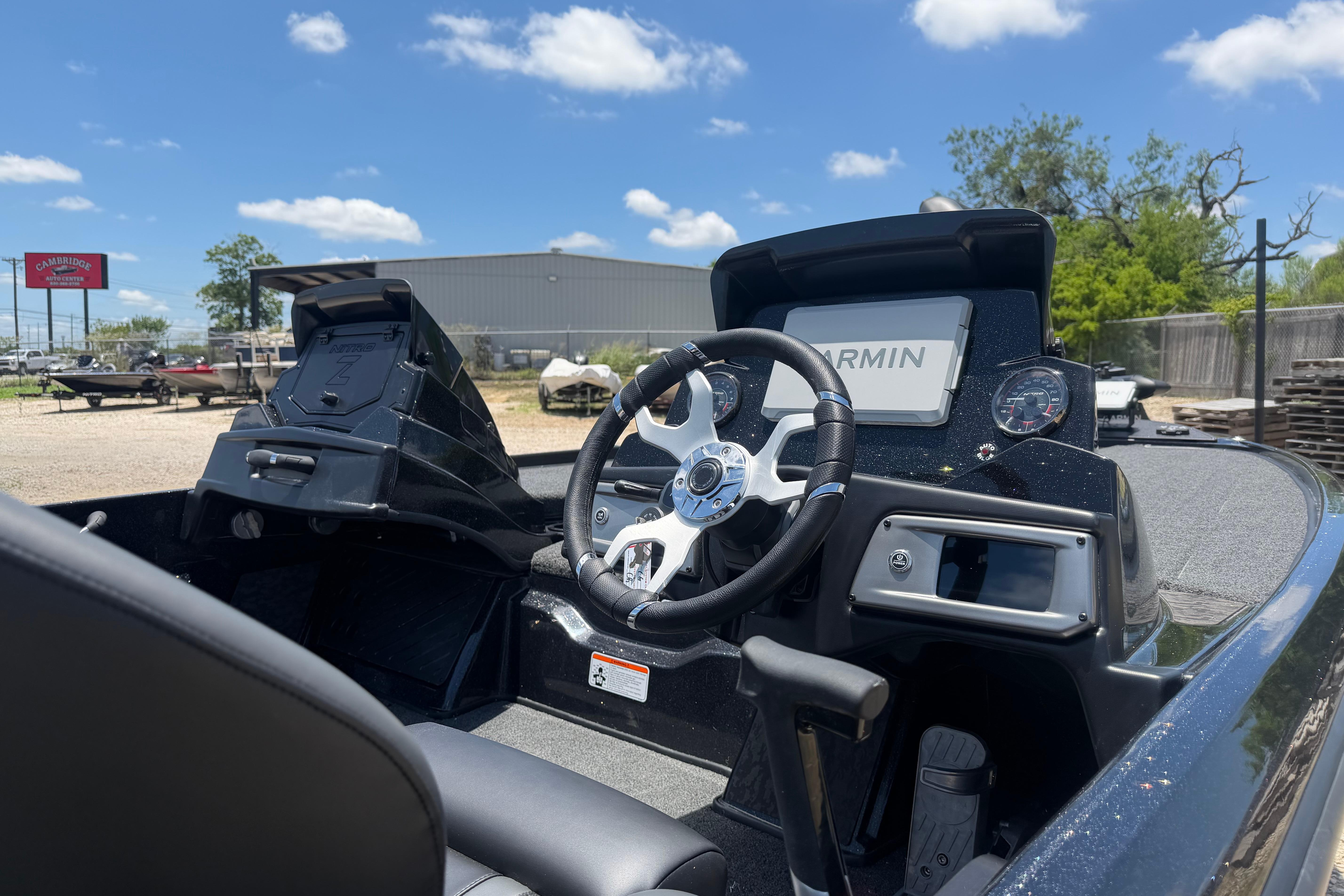 2026 Nitro Z20 XL Pro boat cockpit with Garmin navigation system under clear blue sky.