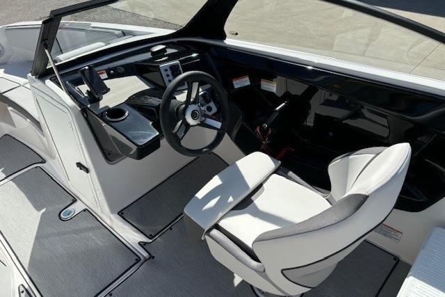 2026 Yamaha Boats AR220 cockpit with modern steering and seating design.