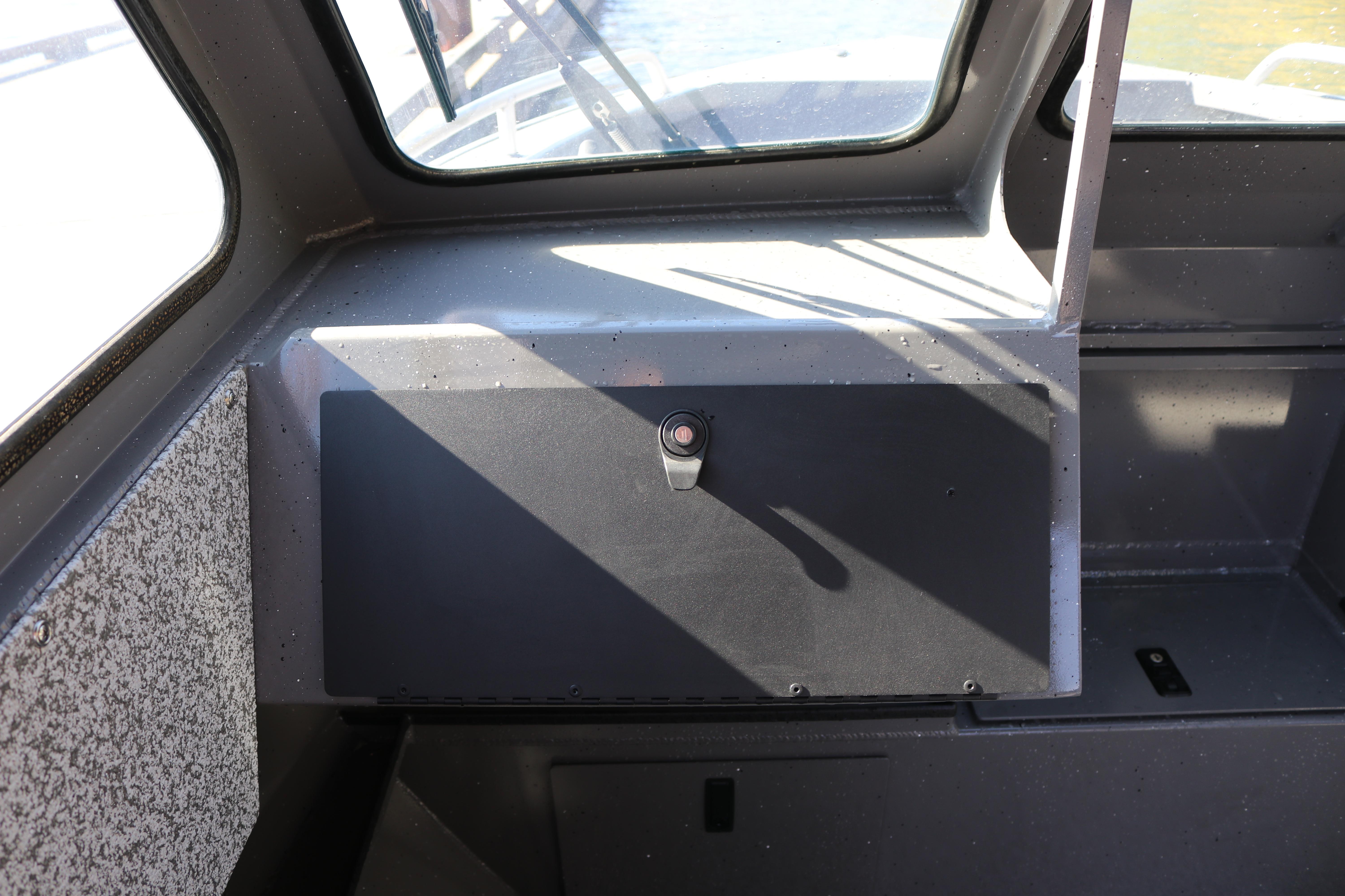 Interior view of 2026 Alumaweld Stryker 220 boat, showcasing dashboard and window design.