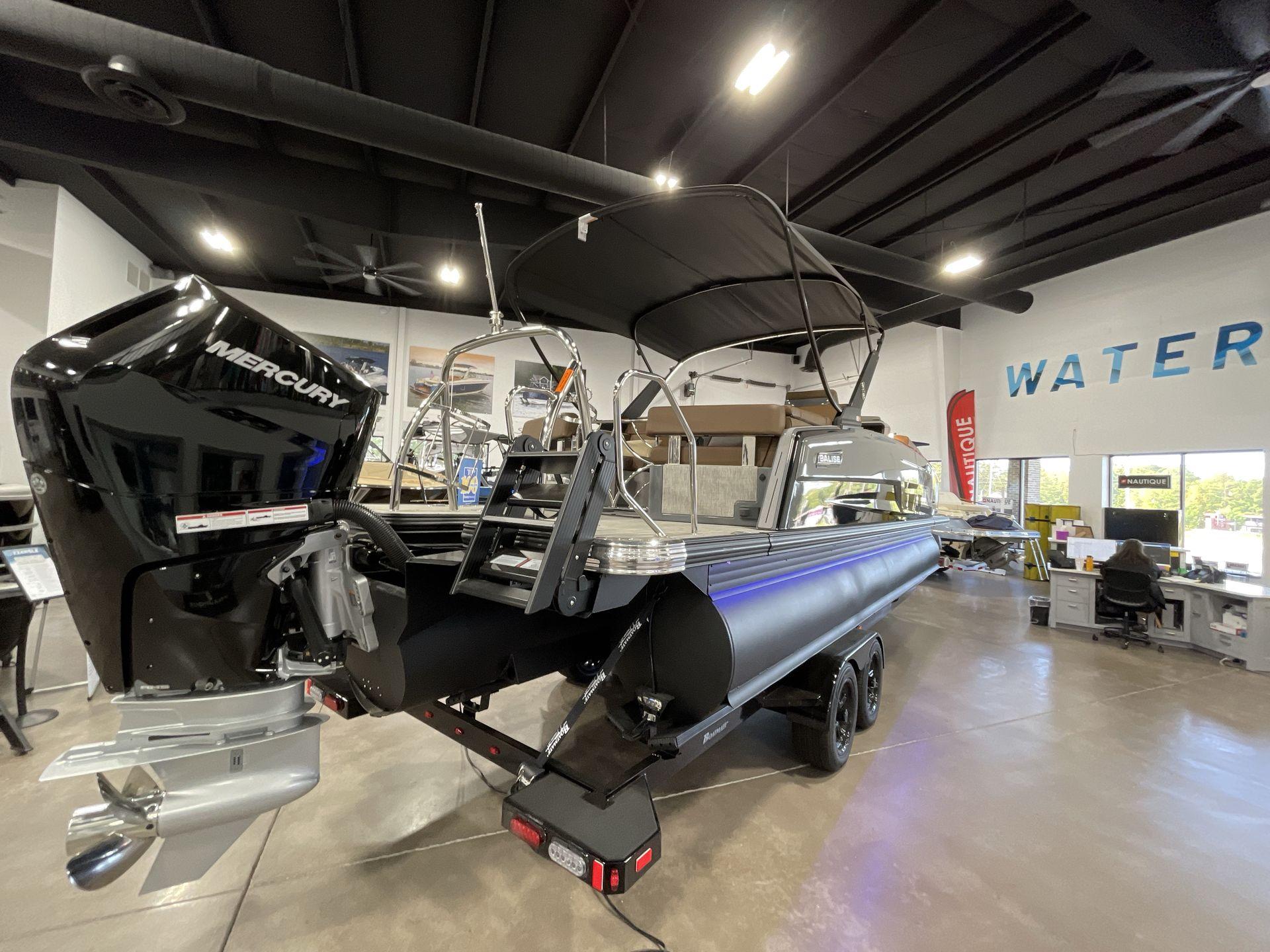 2025 Balise Horizon 26C boat with Mercury engine displayed in showroom.
