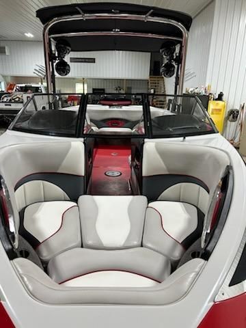 Interior view of a 2009 Malibu Wakesetter 23 LSV with white and gray seating.