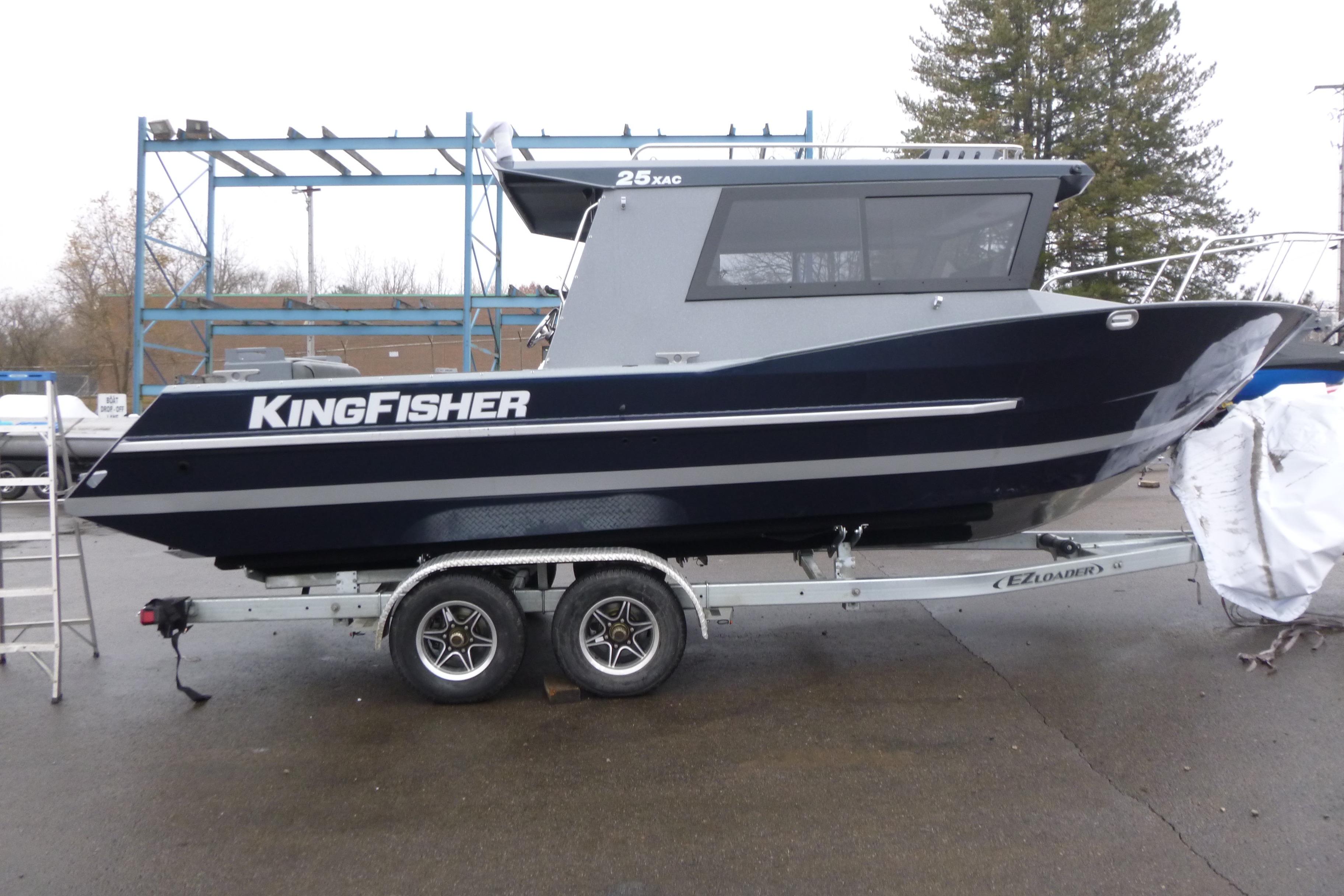 2026 KingFisher 25 XAC boat on trailer, parked outdoors.
